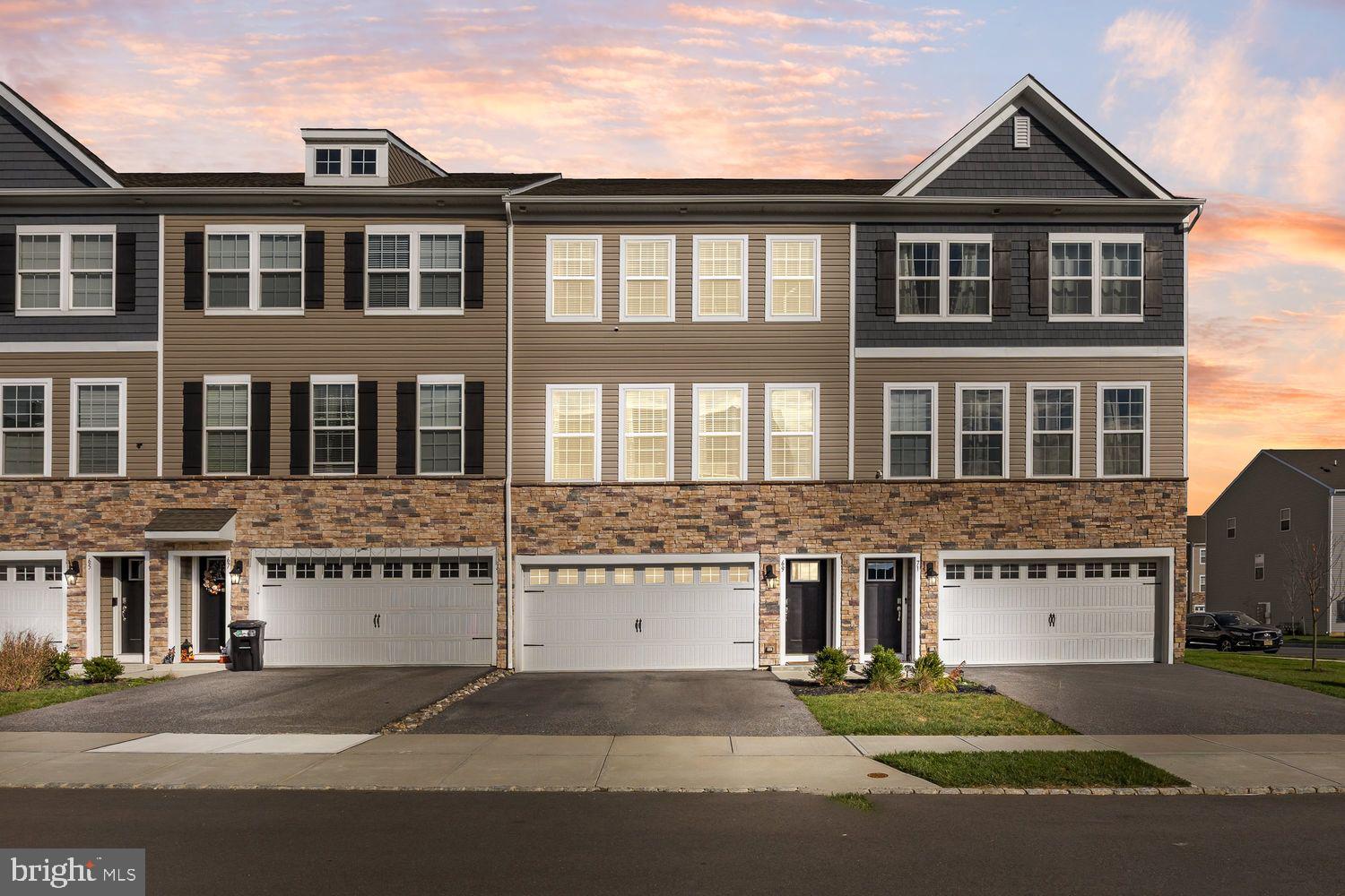 **Welcome to 69 Sister's Farmstead in The Gables at Mount Laure l a newer D.R, Horton Luxury Community.Step into this Like New Modern 3-story Atlas Model Townhome! Modern floorplan with So Many Upgrades!featuring 3 Bedrooms, 3.5 Bathrooms, offers the space and feel of a single family home!  The open concept main level has 9' ceilings, Sun filled Living area, powder room , The  Chef's Kitchen complete with granite counters, a breakfast bar, and a large center island ideal for entertaining,  From the Dining area, sliding glass doors led to a 12x10 composite deck overlooking the fully fenced rear yard with patio and low maintenance turf- a perfect outdoor retreat for summer barbeques and sunset views. Upstairs, the owner's suite features a walk-in closet and a luxury bath with a glass enclosed shower and double sinks.  Two additional bedrooms with ample closet space share a hall bath.  A laundry room on the upper level adds everyday convenience.  The finished lower level with it's own full bathroom (compare to a walkout basement)is ideal for a media room, rec room, gym, home office or guest suite.  Attached two  car garage and energy efficient features complete the package.  The complex at the Gables features a basketball court and playground for your leisure time.  Close to Routes 295,38,73,70,the New Jersey Turnpike and within a 25-30 minute drive to the Philadelphia International airport (PHL) making travel a breeze for commuters or frequent flyers.  with its modern layout, generous living space and proximity t parks, shopping ,dining and top schools 69 Sister's Farmstead Road offers the best of suburban convenience and comfort! A MUST SEE!