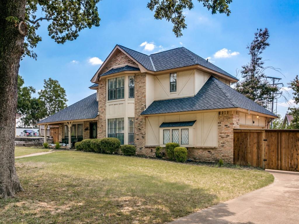 Tucked into the desirable Quail Crest Estates community in Bedford, this charming residence sits on an expansive quarter-acre cul-de-sac lot surrounded by mature trees & enhanced by a brick-bordered landscape. From the moment you arrive, you’ll be captivated by the picturesque front yard & the inviting front porch, perfect for sipping morning coffee or enjoying quiet evenings. Enter through double doors that open into a light-filled entryway with rich hardwood floors & plantation shutters. Inside, the spacious living room boasts a floor-to-ceiling fireplace & flows seamlessly into the kitchen & breakfast room. The impressive family room offers a vaulted ceiling with beams & rich wood paneling with two walls of built-ins, creating the perfect setting for relaxing or entertaining. Enjoy family dinners in the formal dining area with peaceful views of the front yard. 
The kitchen features granite, a central island, warm wood cabinetry, built-in desk, & cozy breakfast room that overlooks the serene backyard.  
The functional layout includes a downstairs secondary bedroom & a private upstairs primary suite, complete with a wall of windows, spacious en-suite bath with dual vanities, garden tub, separate shower, & generous walk-in closet. Two additional upstairs bedrooms share a full bath with dual sinks.
Step outside to enjoy the lush backyard retreat, framed by a privacy fence and mature trees. A flagstone patio provides the ideal space for entertaining, with large side yards and plenty of room for a future pool. Additional features include gated access to a path leading directly to the nearby elementary school, a 2024 roof, and no HOA. Living in Quail Crest Estates means enjoying peaceful tree-lined streets, friendly neighbors, & a location that blends tranquility with convenience, Just moments from shopping, dining, and top-rated schools. Search address in YouTube for video.