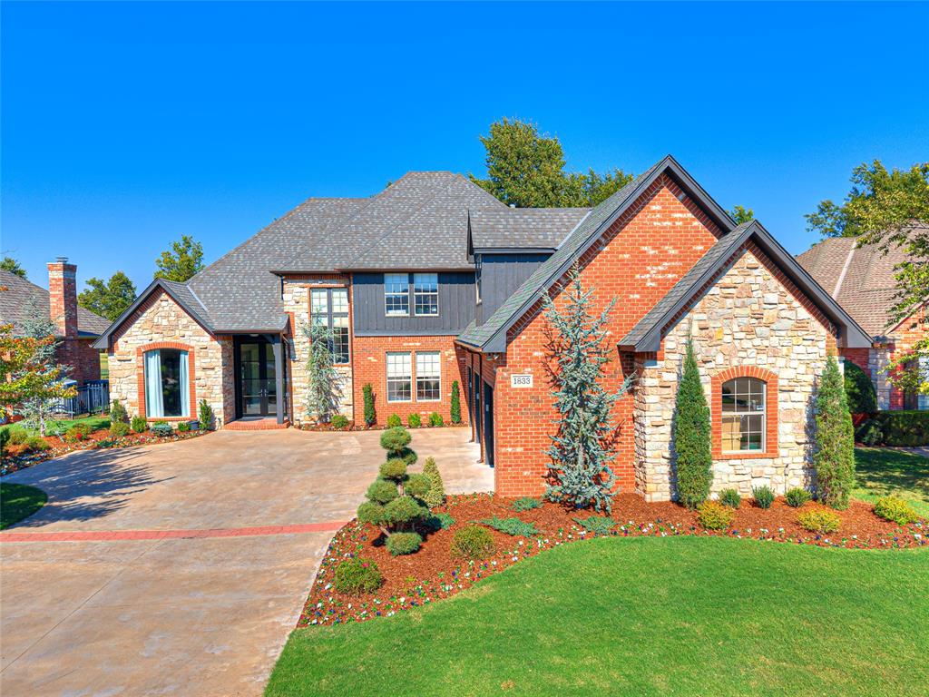 LIVING LAVISHLY WITH A VIEW OF THE FIFTEENTH FAIRWAY! Masterfully made-over 4 bedroom, 3 and 1/2 bathroom home with around $200K of improvements in the last two years, you’ll discover your new favorite feature in every room!  The striking, recently replaced, 10 foot Pella glass door bathes the entryway with natural light and welcomes you into this refined and modernized home. The gorgeous updated entry light fixture; the French doors and beautiful built-ins of the study; the jaw dropping granite fireplace of the living room complete with glass mantel; the attractive & functional cabinets, JennAir cooktop, Frigidaire double oven and microwave, stunning countertops and a walk-in pantry of the kitchen. It’s hard to beat this impressive primary suite, complete with a fireplace, a spa-like bathroom refreshed w/updated granite countertops, shower enclosure, light fixtures, plumbing fixtures, patio access, and large closet. Upstairs, the huge bonus room’s acoustic wall and 75'’ TV will remain with the house.  Three more spacious bedrooms and two fully remodeled bathrooms finish the upstairs, ensuring everyone has their own place to chill. Laundry won’t be such a chore in this utility room either with plenty of updated, granite counter space and lighting.  The dining room and a remodeled powder bath completes the interior of the home. Enhanced with refreshed flower beds, landscaping, and handsome garage doors, new in September 25, this home makes a lasting impression.  But, THE GOLF COURSE VIEW IS THE SHOWSTOPPER!  From your own backyard, bask in the beauty of the rolling greens. – It’s a view that never get’s old!  FULLY LOADED WITH EXCEPTIONAL UPDATES, this OAK TREE HOME is MOVE-IN READY and waiting for you! Don't let this beauty pass you by!