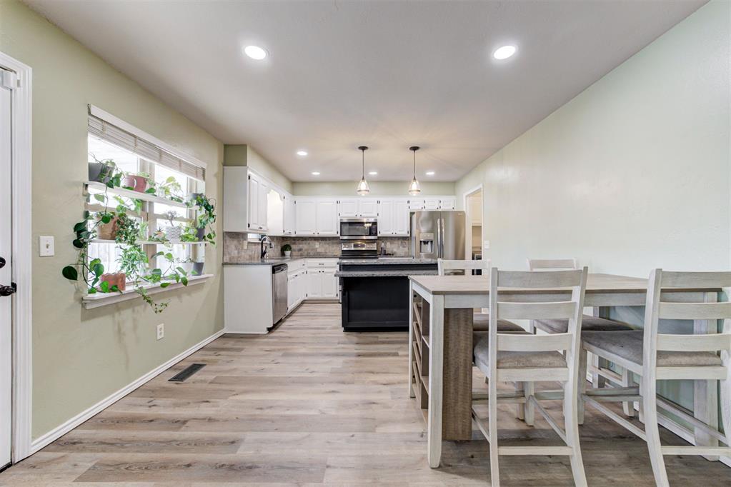 Character Reimagined: The Unicorn You’ve Been Waiting For! Get ready to fall in love with a home that mixes vintage cool with that brand-new feel. This isn't just another cookie-cutter house; it is a total vibe! We are talking about character reimagined with all the major updates you actually want. Imagine walking on brand-new floors and seeing fresh paint in every room. Plus, the boring-but-important stuff is already handled for you. We have a new roof from December 2025, a hot water tank from 2023, and the AC, heater, and appliances were all updated in 2021. It is basically the best of both worlds!But hold on, because the fun doesn't stop there. While most homes nearby feel a little tight, this one has space to spare. We are talking about four true bedrooms plus an extra bonus room that could be anything you want, like a game room, a home office, or a hobby spot. The backyard is huge, giving you plenty of room to run around, garden, or just relax in the fresh air. If you have been looking for a place where everyone can have their own space without bumping into each other, this is definitely it.Let’s talk about the heart of the home. The kitchen feels open and airy with a center island that is begging for a pizza night or a morning breakfast spread. You will love the cabinetry too. It is that solid wood kind you only find in older homes—super sturdy and ready to hold all your gadgets. The open living room is anchored by a real working fireplace, which is perfect for cozy movie nights. And when you need to head out, you have super easy access to the interstate, shopping, and all the tasty restaurants nearby.OPEN HOUSE: February 7th and 8th!