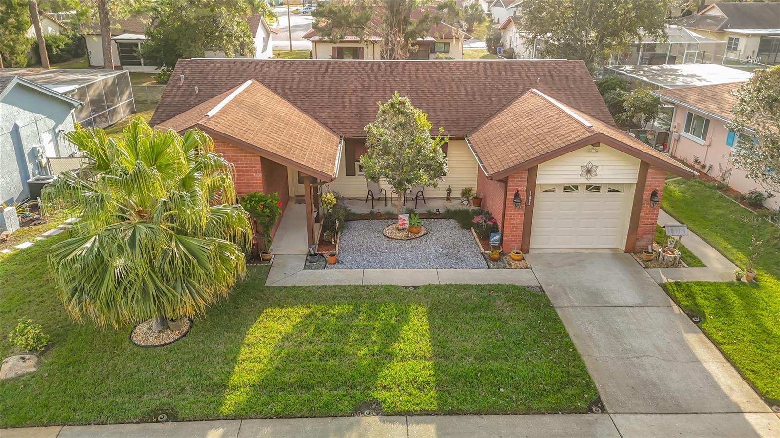 Charming 2 Bedrooms | 2 Bathrooms | Energy efficient Home. Welcome to your new sanctuary! This adorable two-bedroom, two-bath home perfectly blends cozy living with incredible outdoor entertainment possibilities and modern energy efficiency. Enjoy the convenience of newer appliances throughout the home, including a high-quality washer and dryer and a brand-new hot water heater. Significant investments have also been made to ensure maximum comfort and minimum utility costs, including new HVAC & Ductwork and solar panels to significantly reduce electricity bills.  Enjoy peace of mind and consistent temperatures year-round with a these recent updates. A Private Water Well is available specifically for watering the lawn, keeping your landscaping lush without driving up your municipal water bill. The beautiful courtyard is the heart of this home, featuring lush, manicured landscaping that creates a serene atmosphere. Hosting a weekend barbecue or unwinding after a long day, is easy with the dedicated outdoor living space. Whether you're Relaxing in the cozy private spa or Enjoying the complete outdoor dining area and grilling station, this home is the perfect spot for any gathering. Discover the charm of Beacon Woods East! A designated Bird Sanctuary, perfect for nature lovers, this neighborhood features ample sidewalks, a huge saltwater community pool, and tennis courts.  Conveniently located minutes from top schools, hospitals, and shopping, and just a short drive via Suncoast Pkwy to Tampa Airport and world-class beaches. Come see why this is the perfect place to call home!  NO FLOOD ZONE! This property is located outside of designated flood zones, providing safety and potential insurance savings. LOW HOA FEES! Enjoy extensive community amenities without the high cost, making for an affordable lifestyle. Don't miss the opportunity to own this efficient, relaxation-ready home. Schedule your private tour today!