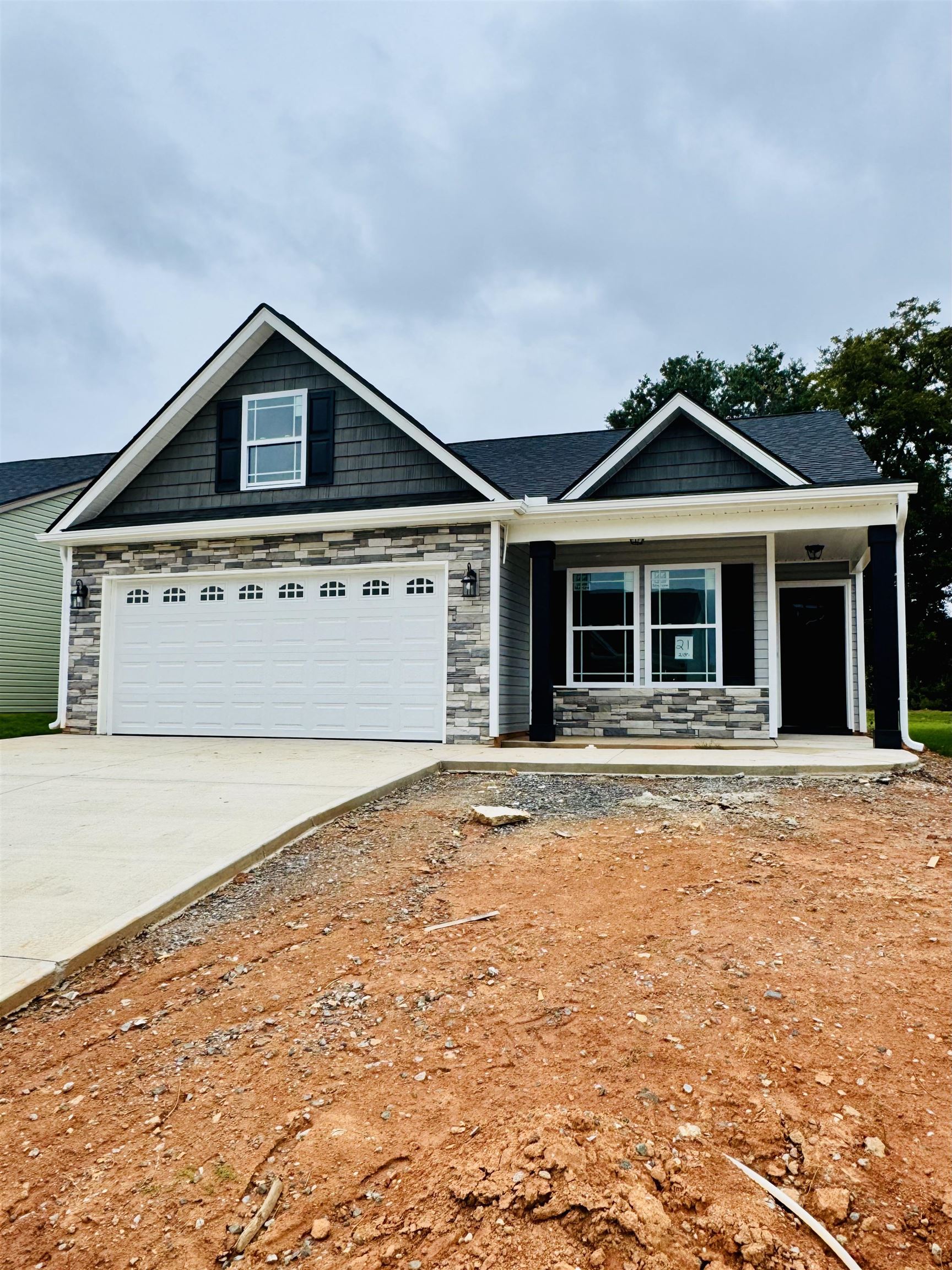 **Estimated completion date of 10/9/25!** Preferred Lender/Attorney Closing Costs Incentive Offered!  Welcome to Hampshire Heights! The Clifton plan offers a formal entry way, a cozy living area, and an open concept kitchen/dining combo. 3 bedroom, 2 bath. Complete with the trademark chair rail, crown molding and rope lighting.