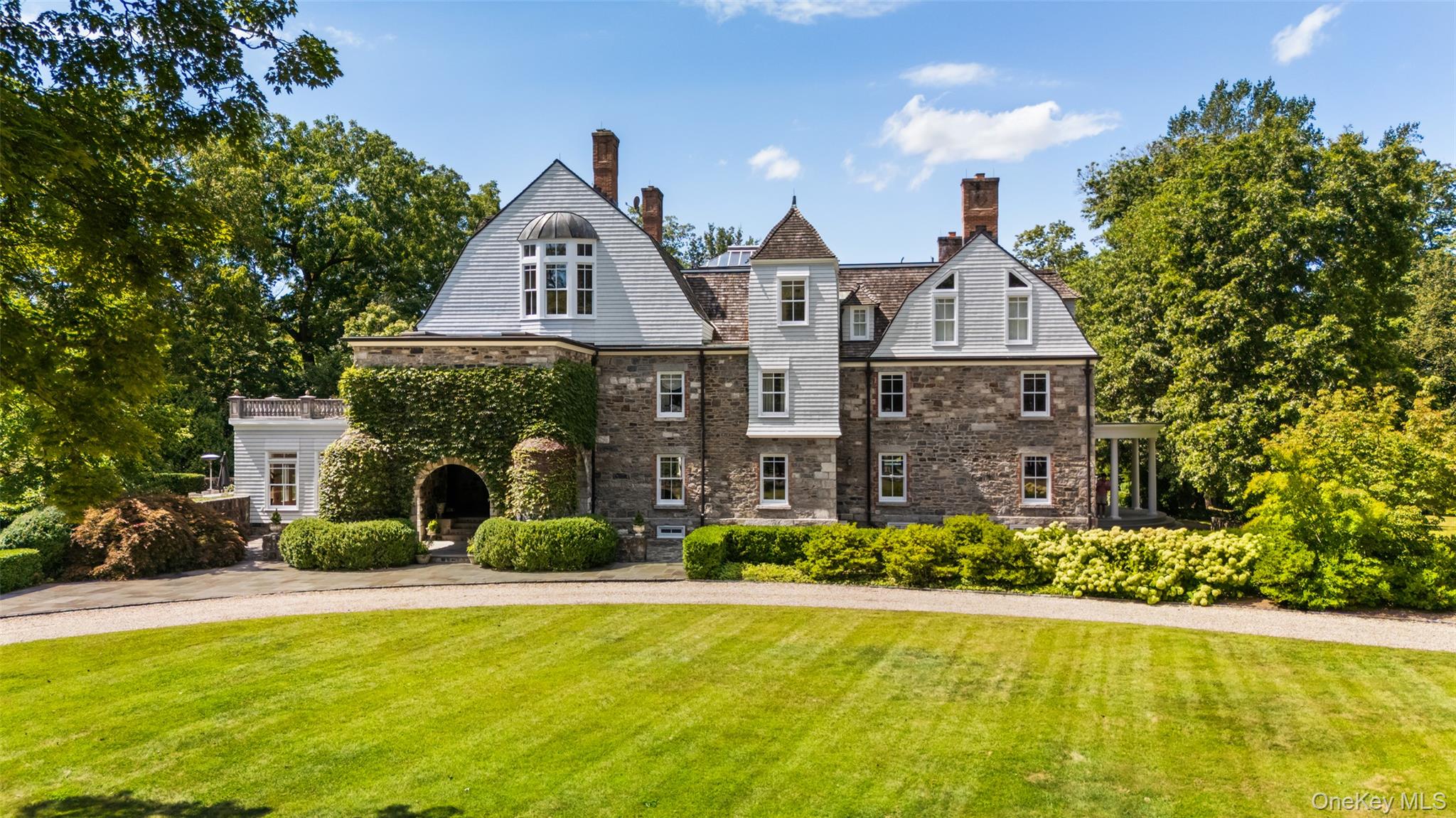 INLAND VALE. Steeped in history. One of Northern Westchester’s most significant Country Estates. Magnificent and majestic stone and shingle residence originally built in the 1850’s. Renovated by Stanford White for Ulysses S. Grant, Jr. Remarkable preserved details including spectacular aged paneling, ten fireplaces with vintage mantles and tile, and extensive millwork. Long tree-lined drive to dramatic stone entrance. Magnificent oak paneled Great Hall with grand staircase and ceiling of Tiffany stained glass. Beautifully proportioned main rooms designed for entertaining on the grand scale. Impressive Living Room with mirroring fireplaces and French doors to columned porch. Formal Dining Room. Chef’s Kitchen with high-end appliances. Sun-filled Family Room with Breakfast Area and doors to outdoor terrace in walled garden. Remarkable Primary Suite with spacious Dressing Room and two Baths. Six additional Bedrooms. Playroom with built-in desks, game closet and doors to rooftop porch. Full Third Floor with glass-ceilinged Sitting Room, second Kitchen, Art Room/Studio and Exercise Room. Lower Level with Game Room, Wine Cellar and Pool Cabana. All mechanicals are updated including center air conditioning and a generator. Baths are Waterworks with luxurious radiant heat. Over eleven park-like acres with specimen trees, flowering shrubs and verdant lawns. Incredible old world stonewalls and terraces. The perfect retreat complete with swimming pool, tennis and half-basketball court. A once in a lifetime opportunity!
