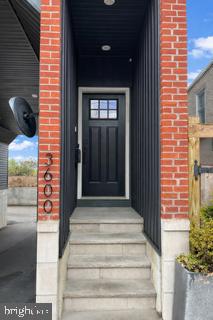 Tucked away in one of East Falls’ most charming settings, this newly constructed carriage home blends modern design with warm, sophisticated finishes. Sun-filled open living spaces feature rich hardwood floors, soaring ceilings, and a dramatic multi-level staircase that creates a striking architectural centerpiece.The designer kitchen anchors the main living area with crisp white cabinetry, quartz countertops, a statement tile backsplash, stainless steel appliances, and a spacious island perfect for gathering and entertaining. Stylish globe pendant lighting and contemporary railings enhance the home’s clean, modern aesthetic.The open floor plan flows seamlessly from living to dining, offering flexible space for entertaining or everyday comfort. Thoughtful design details, abundant natural light, and beautifully curated finishes create a home that feels both refined and inviting.Enjoy the best of East Falls living with skyline views of Philadelphia, nearby parks and trails, and easy access to Center City, Kelly Drive, and major transit routes.A rare opportunity to own new construction in one of Philadelphia’s most desirable neighborhoods.