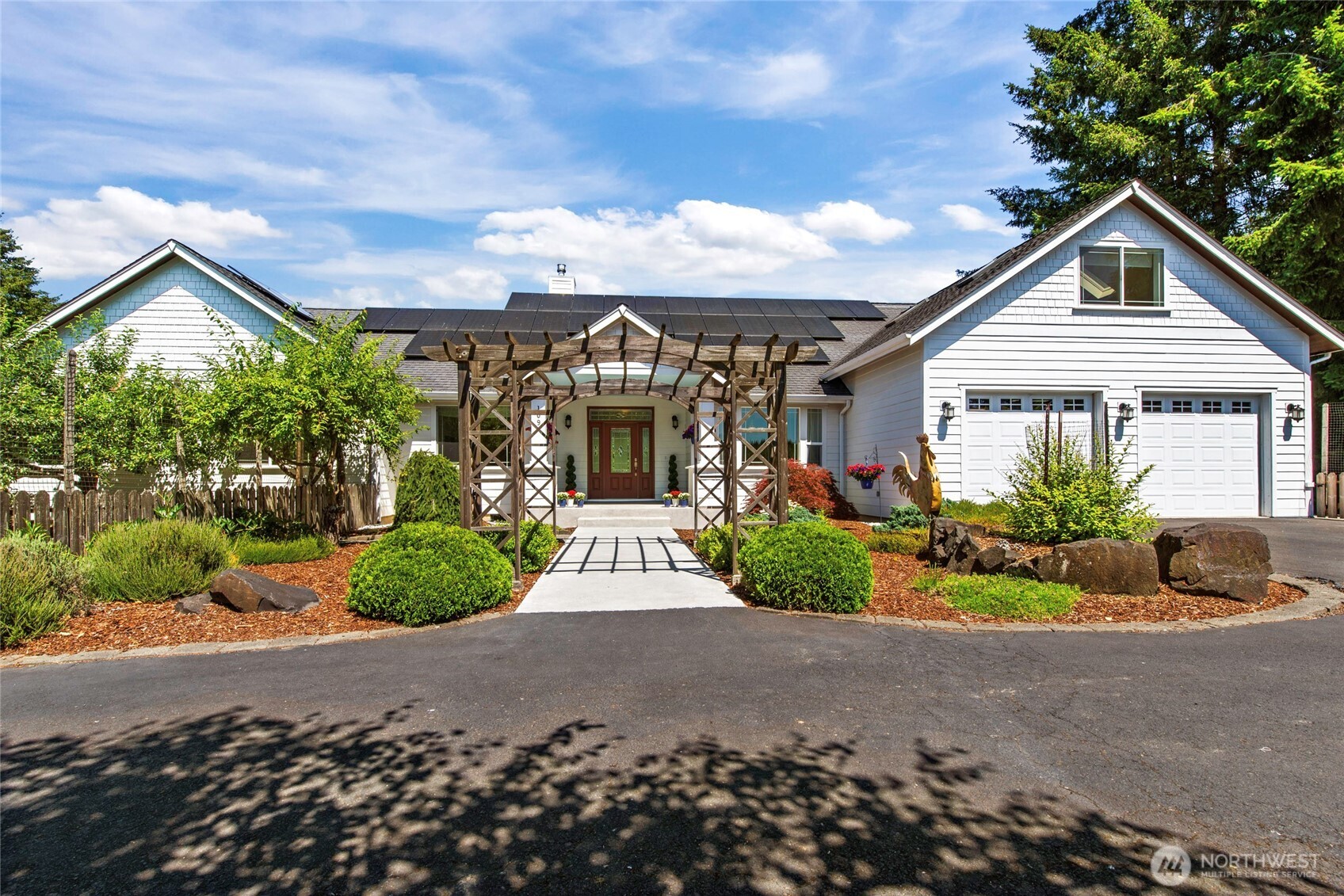 First time ever offered! Exceptional custom estate on 5 private acres bordering the Willapa Hills Trail, where hiking, biking and horseback riding begin at your doorstep—just minutes from downtown Chehalis, I-5, local museums and the athletic club. Designed for entertaining and effortless everyday living, this stunning 4BR, 3.75BA home showcases soaring 16' ceilings, walls of windows, natural stone flooring, granite countertops and expansive covered outdoor living. The luxurious main-level primary retreat features patio access, heated floors, a jetted tub, dual shower heads, walk-in closet and spa-inspired bath. Upstairs offers a spacious bonus room, bedroom and full bath—ideal for guests, multigenerational living or a private retreat. Outside, enjoy raised gardens with zoned irrigation, a fruit orchard, blueberry bushes, fenced backyard, custom sauna, winding wooded paths, detached garage, barn, RV parking and owned solar panels (2023). The home is generator-ready, with the main residence wired for a generator, 220 power available in both the attached garage and barn, and a detached garage already wired for future electrical connection. A rare opportunity to own an impeccably maintained legacy property where luxury, privacy and nature come together.
