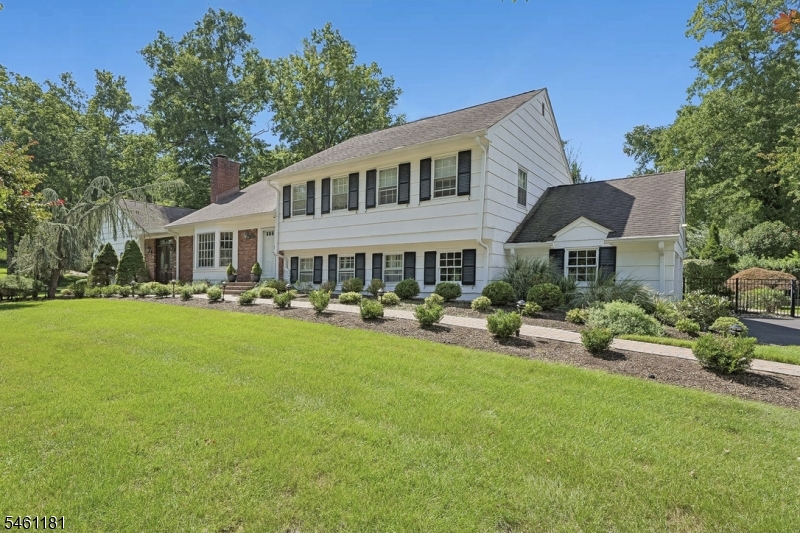 FABULOUS SHORT HILLS DEERFIELD SECTION HOME * Located on a quiet street in a premier Short Hills neighborhood, this 5BR, 5BTH custom home offers refined living w/an easy flowing floor plan. Step into the skylit, double height foyer & enter the Great Room w/vaulted ceilings, bay window & custom lighting. The formal dining room w/FP is the perfect spot for entertaining guests, while a library & sitting room provide space for everyone. The eat-in kitchen w/center island features a Wolf 5-burner cooktop, wall oven w/built-in microwave & breakfast bar seating. Upstairs find 4BR & 3 full BTHs. The primary suite w/treetop views is located on its own level & features a renovated BTH and huge walk-in closet. The ground level has a coveted in-law suite/BR 5 w/full BTH, plus a mudroom, additional renovated full BTH for the pool & 2-car garage. The lower level has a rec room, laundry & plenty of storage. Step outside and prepare to be wowed by the stunning in-ground pool w/waterfall, paver patio & beautiful deck overlooking the fully fenced backyard. 14 Westview Road is located in the highly desirable Deerfield neighborhood, & is close to all that Millburn/Short Hills has to offer including top-rated schools, Gero Park with ballfields, tennis courts and the town pool, the South Mountain Reservation with 1500 acres of trails and woods, and bustling downtown Millburn with the farmers market, shops, restaurants & train station for an easy commute to NYC. Welcome home!