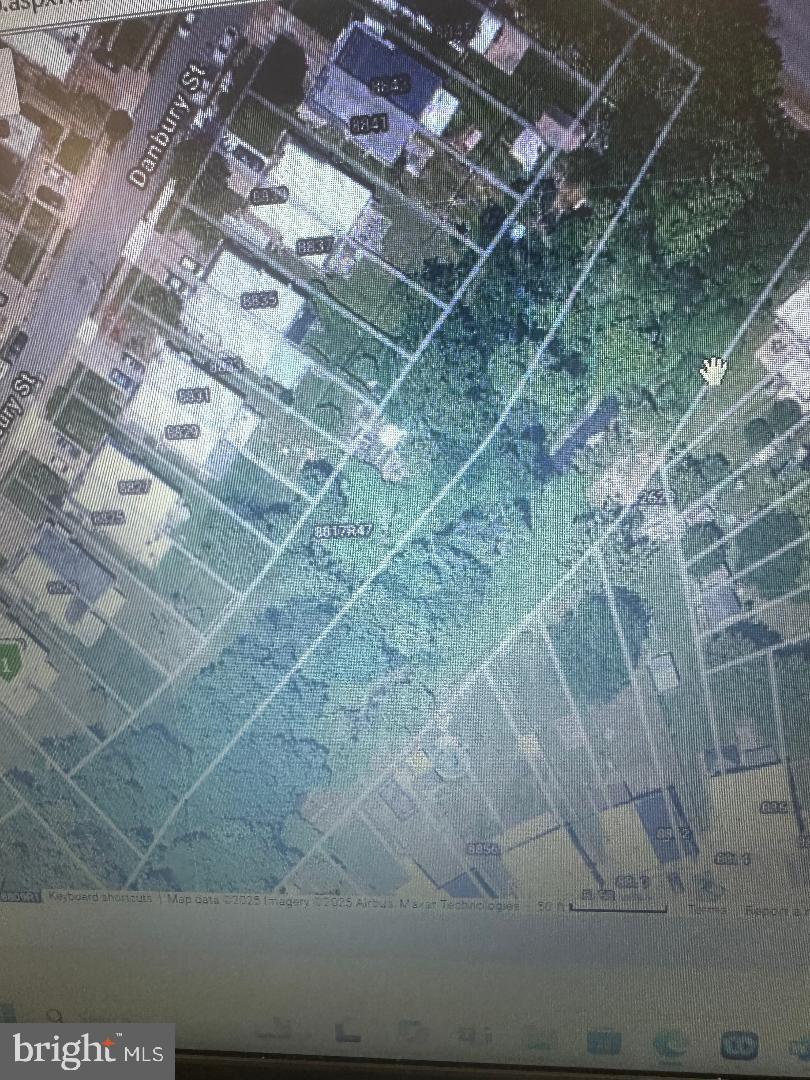 Massive 26, 191 Square Ft Lot Located in Holme Circle. Irregular Shaped - Rough Dimensions are 35 Feet Wide by 478 Feet Deep. Potential uses for this could be to develop a row of garages. You could clear the trees and park equipment or vehicles here.  This lot could be subdivided and the parcels individually sold to the homeowners on Danbury Street. Use your imagination, this amount of square footage in a hot zip code is very unique and rare. It hugs the creek the entire length of the parcel (478 Feet). Lot is zoned RSA3. Annual taxes are low : $1,329. Buyer responsible for obtaining a clear U&O. Property is being sold as is. Looking for a cash deal !