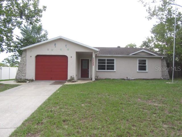 One-story pool home at 2088 Bolger Ave in Spring Hill, Florida 34609, offering 1,608 square feet of comfortable living space with three bedrooms and two full bathrooms, plus an attached garage for convenient parking and storage. Step inside to discover a spacious and open floor plan that flows effortlessly, highlighted by a cozy wood-burning fireplace in the family room—perfect for relaxing evenings or entertaining guests. Outside, enjoy Florida living at its finest with a covered and screened patio overlooking in-ground pool, complemented by a large fenced rear yard complete with a storage shed for all your outdoor needs.  Ideally located in the heart of Spring Hill, this home places you minutes from the world-famous Weeki Wachee Springs State Park, where you can experience iconic mermaid shows, swim in the crystal-clear spring waters, or cool off at Buccaneer Bay water park. Just a short drive away, explore the charming historic downtown of Brooksville, nearby golf courses, local parks, and nature preserves. Within about 15–20 miles, unwind at family-friendly Pine Island Beach Park or Hudson Beach for Gulf sunsets, swimming, and picnics, while everyday shopping, dining, and amenities are right around the corner—making this the perfect blend of peaceful residential living and easy access to the best of Florida’s Adventure Coast.  Priced to sell quickly with 2008 Roof, 2015 AC and 2024 water heater.