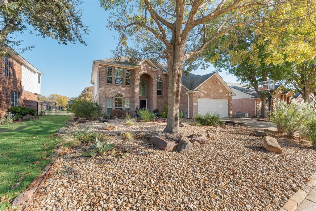 Welcome to your new home in Frisco!  This beautiful home has it all!  The home comes with dry landscaping for easy maintenance year round.  There are no carpets in this home. Step inside and immediately feel the elegance—soaring ceilings, a grand staircase, rich wood flooring, plantation shutters, and abundant natural light. Both formal living and dining spaces offer flexibility for entertaining or everyday living. The open living room features a dramatic floor-to-ceiling stone fireplace and flows seamlessly into an updated kitchen with white cabinetry, granite counters, gas cooktop, and a spacious breakfast area overlooking the water. The primary suite is a true retreat—spa-style bathroom with vessel sinks, oversized dual vanity, modern lighting, walk-in shower, and a gorgeous freestanding soaking tub surrounded by dramatic stone tile. Secondary baths are beautifully renovated with custom tilework and updated fixtures. Enjoy relaxing evenings in the large screened-in porch OR step outside to experience the incredible waterfront views from your backyard, patio, or upper deck. The peaceful setting offers multiple sitting areas, mature landscaping, and room to garden or entertain outdoors. The home has solar panels, EV Charging station, a raised garden, and all light switches are smart switches.  Come take a look today!