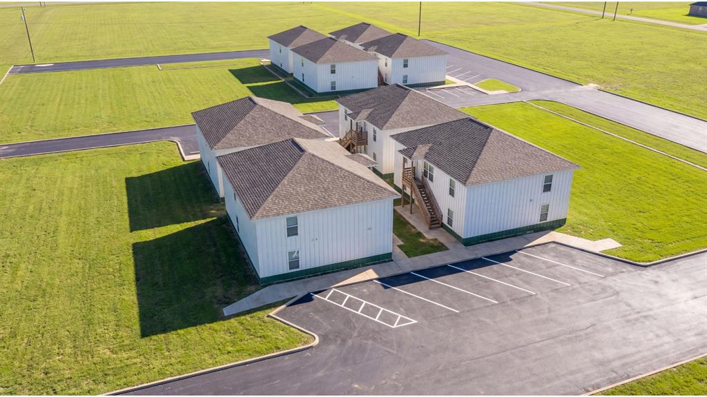 Brand new construction multifamily investment opportunity just 1/2 block from the University of Central Oklahoma (UCO)!This listing includes four (4) eight-plex buildings on one parcel (cannot be divided), totaling 32 bedrooms and 32 bathrooms. Each of the 4 stacked duplex is approximately 3,000 sq. ft. MOL (2 levels) and thoughtfully designed offering 4 private bedrooms and bathrooms per floor. Each bedroom is a private suite with keypad-entry lock. Each floor features a shared common living room, kitchen and laundry area, exclusively serving the four bedrooms on that level-ideal for student or roommate- style living while maintaining privacy. Rental comps support approximately $650 per bedroom, providing strong income potential in a high-demand rental corridor near UCO. Property is under construction and expected to be delivered vacant. Closing can occur shortly after issuance of Certificates of Occupancy.Addresses include 1021, 1025, 1029, and 1033 E Hurd St., Edmond, OK 73034.A rare opportunity for investors seeking new construction, low maintenance, and consistent demand. Located within a federally designated Opportunity Zone, offering potential tax advantages for qualifying investors. Buyer to verify eligibility and tax implications with their advisor.