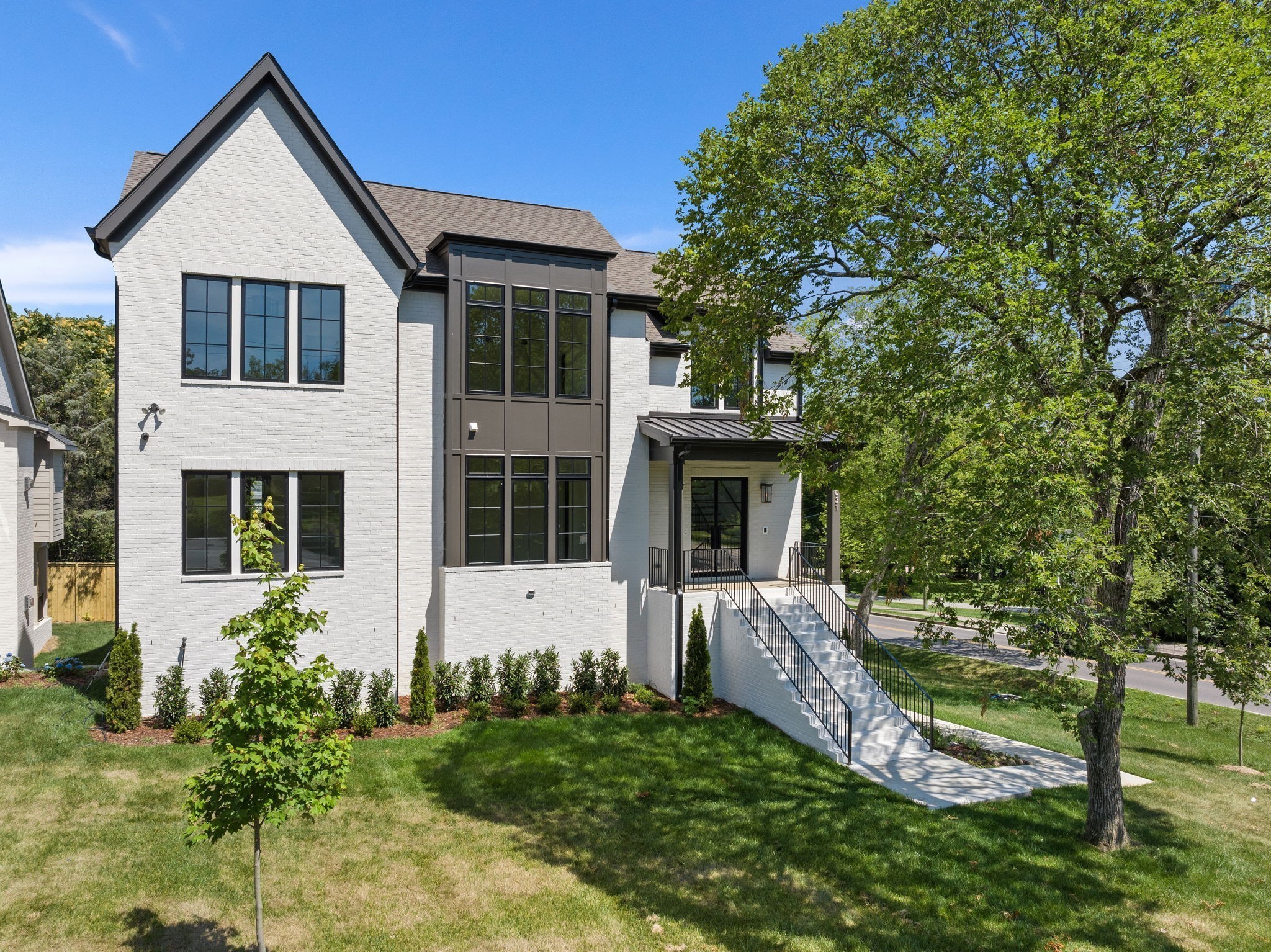 12 x 24 Gunite Pool included with Price!!  Experience contemporary living at its finest in the heart of Green Hills, enjoy walkable access to upscale dining and shopping. Each room has been elegantly crafted by Mekenna Brooke Designs. This home features two main-level bedrooms, including an Owner’s Suite and en-suite, along with in-law quarters with a separate entrance on the lower level offering both luxury and privacy. Upstairs, discover three additional bedrooms and a bonus room, perfect for guests. Entertain effortlessly in the open-concept layout and screened porch with fireplace. The gourmet kitchen boasts floor to ceiling cabinets and Wolf/Sub Zero appliances. The lower level also includes a spacious media room and wet bar, and a 3 car garage. An elevator shaft is framed in and ready to be installed if the buyer wishes to do so. The location cannot be beaten, offering a suburban feel but is walking distance to fine dining and upscale shopping of Green Hills and only 10 minutes to downtown Nashville.