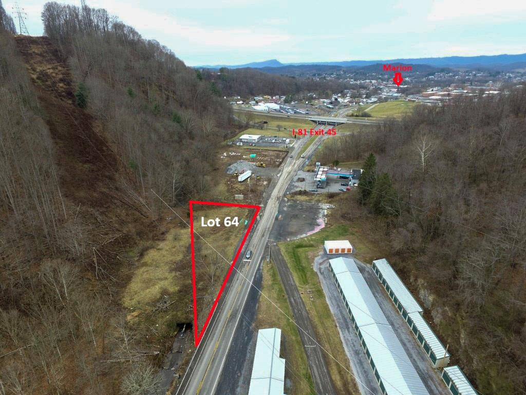 Level Commercial Lot along Highway 16, Marion VA along Exit 45 of interstate I-81. This easy-to-develop lot is along where the interstate corridor and the vast natural resources in the area converge. With quite a bit of road frontage, this level lot adjoins the creek that runs from the fish hatchery up stream which could benefit your business of tapping into the natural resources along the mountains of Southwest Virginia. Viable business options include truck and trailer parking or convenience store along this busy volume of traffic between Roanoke and Bristol.