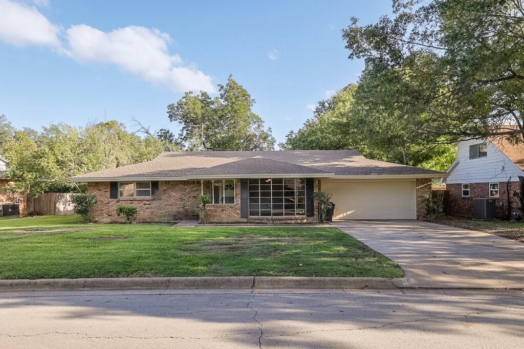 Welcome home to 2709 Larkin Ave, a move-in-ready 3-bedroom, 2-bath home tucked into Fort Worth’s established South Hills neighborhood. Offering over 2,000 square feet, this floor plan gives you plenty of room to spread out with two living areas, two dining spaces, and an attached front-entry 2-car garage. Recent updates make this one stand out from the curb, including fresh interior and exterior paint, new flooring throughout most of the home, updated light fixtures and ceiling fans, new door hardware, and updated plumbing fixtures. The kitchen features new quartz countertops, abundant cabinet space, an electric cooktop and oven, a dishwasher, breakfast-bar seating, and a dedicated breakfast area with a windowed sitting ledge. The main living area brings great character with vaulted ceilings and a floor-to-ceiling brick fireplace with gas logs, creating a warm and inviting focal point. The flexible second living and dining spaces provide plenty of options for a home office, media room, entertaining, or additional living space. The primary bedroom features a private bath with a tub-shower combination and walk-in closet, along with two additional bedrooms and a second full bath. Step outside to a spacious 24x12 covered patio that has been repaired and tiled, providing a great shaded retreat for relaxing, entertaining, or weekend barbecues overlooking the fenced backyard. Additional features include an in-ground sprinkler system, separate utility room, and generous storage throughout. Conveniently located in South Fort Worth with easy access to I-20 and Loop 820, along with shopping, restaurants, grocery stores, and everyday conveniences throughout the Hulen, McCart, Trail Lake, and Seminary corridors. All information is deemed reliable but not guaranteed; Buyer and Buyer’s Agent to verify schools, square footage, acreage, taxes, and other information.