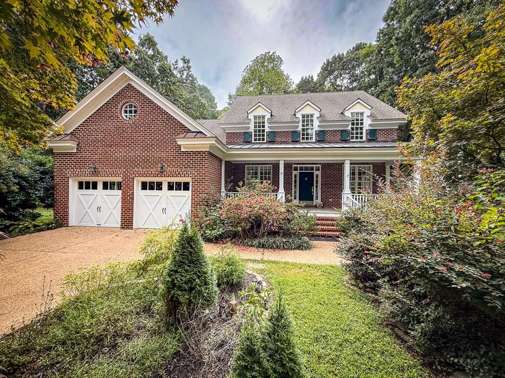 Custom brick William Poole design home on double lot overlooks 1st hole of the Jack Nicklaus course. Located on a very private cul-de-sac this light filled home w/ mature landscaping & gardens has handsome hardwood floors & extensive crown molding & custom built ins thru out. Chef's kitchen has custom cherry cabinets, stainless steel appliances & corian countertops. Family room w/ gas fireplace & over sized windows has large loft which could easily be turned into a 4th bedroom. French doors lead out to a huge back deck overlooking gardens & golf course. Spacious 1st floor primary suite has lovely views of gardens . Upstairs has entertainment room w/ wet bar. Large storage room & walk up attic. Irrigation system for landscaping. Community amenities include white sandy beaches, pool & tennis