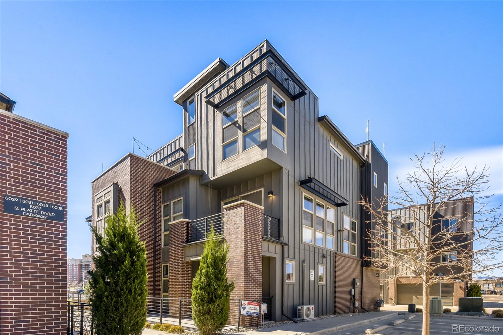 This beautiful 4-story townhome feels like a single family home and features 3 bedrooms, 3.5 baths, office/bonus space, family & dining rooms, open kitchen, 4th floor flex space and a spectacular rooftop deck and two car attached garage.  Fresh and on trend - this home boasts hardwood floors, slab quartz, stainless steel appliances, custom murals in secondary bedrooms and much more.  Low maintenance living that is perfect for that busy individual or family on the go. Enjoy the views from the rooftop deck and wind down after a long day - a peaceful retreat.  An open kitchen is great for entertaining.  This home is move-in ready.   It is easy to picture yourself calling this one home.  An energy efficient furnace, central air and ceiling fans keep this home comfortable all year long.  Close to dining, shopping, entertainment and other amenities.  Easy To Show - Quick Possession.  Don't miss your opportunity.  Welcome Home!