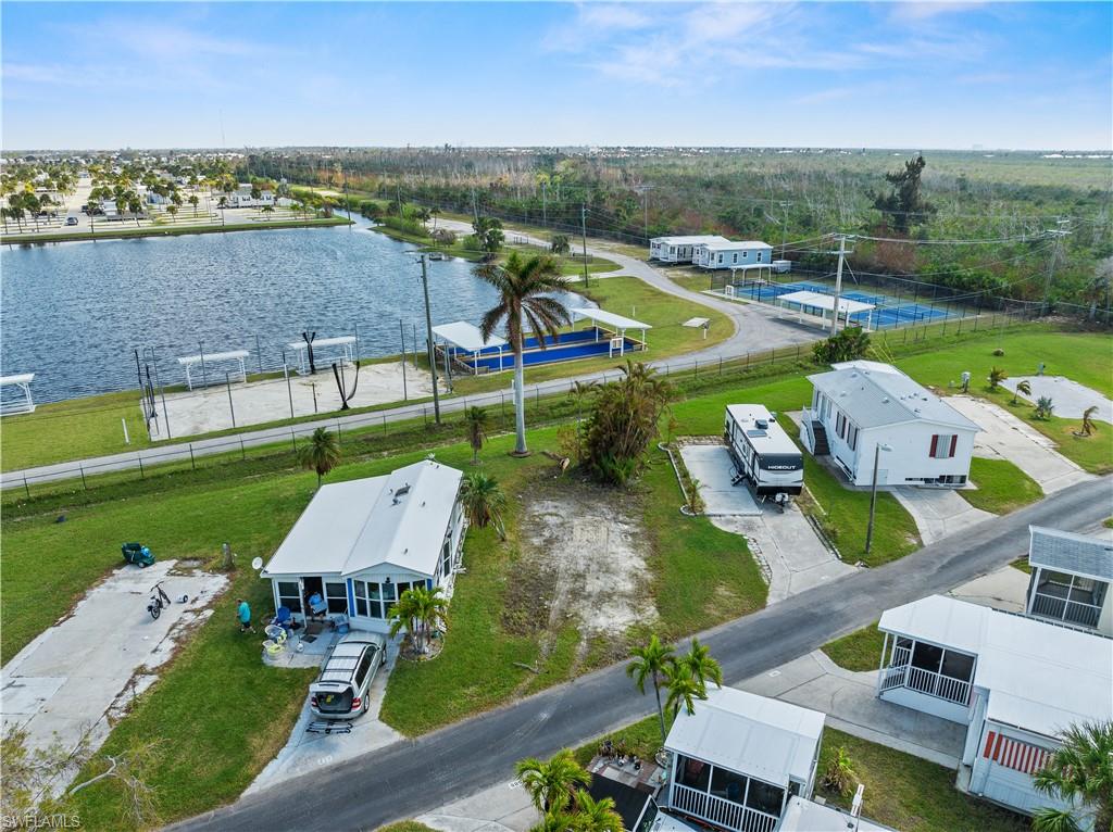Discover the perfect opportunity in the sought-after Palmetto Palms RV Resort—a desirable "PET LOT" that’s outside the designated pet section, offering flexibility and privacy in this charming 55+ community. This lot will be sold with electric hook-up restored by the seller prior to closing, and the special assessment has already been paid as well.

Enjoy an array of community amenities, including a well-appointed clubhouse, two pools, tennis and pickleball courts, and a full calendar of activities tailored to an active lifestyle. Palmetto Palms offers a unique ownership experience where you own your land, and essential utilities such as water, sewer, cable, and electricity are all available. Choose to park your RV or place a new manufactured home on this versatile lot!

The community also provides convenient boat storage and is located just a short walk or bike ride from Bunche Beach. With easy access to Fort Myers Beach and Sanibel Island, you’ll find endless opportunities for boating, beach days, fine dining, and exploring Southwest Florida’s vibrant coastal lifestyle. Don’t miss this rare chance to own a lot in Palmetto Palms RV Resort—your tropical oasis awaits!
