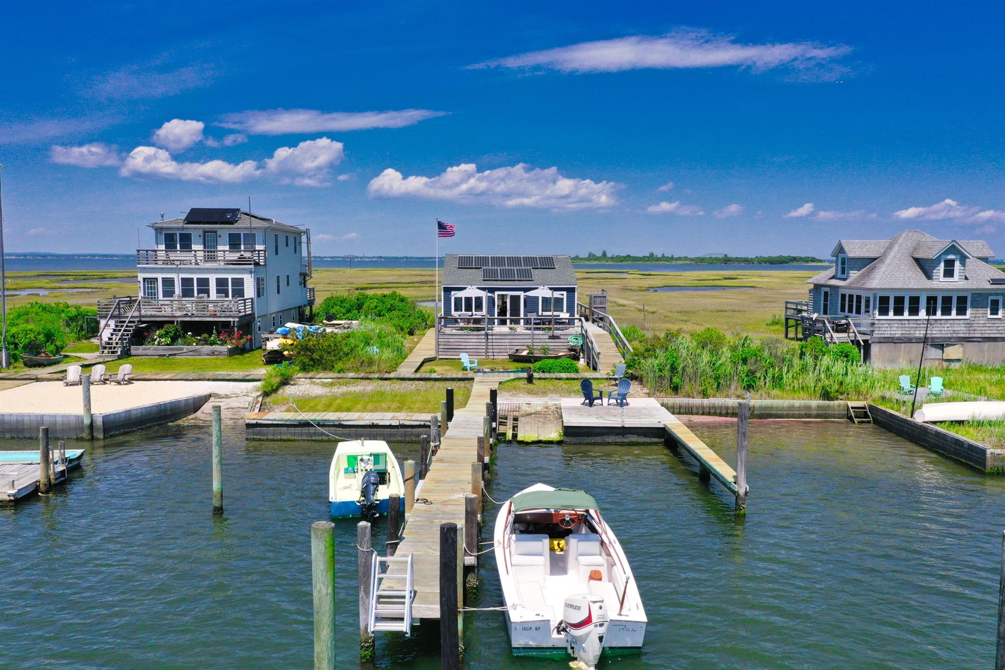 Discover an exclusive retreat at 94 1/2 Oak Street. Oak Island, Babylon, NY—your private sanctuary on the Great South Bay. This off-the-grid, turn-key cottage offers a perfect blend of modern amenities and natural seclusion, accessible only by boat through an unmarked channel that requires local knowledge to navigate, ensuring unmatched privacy. 

Nestled on a generous 10,150 square foot lot, this charming 2/3-bedroom, 1-bathroom home features a deep water dock and private outdoor space ideal for boating and relaxation. The property includes a fresh water well and an outdoor hot and cold shower, adding convenience after a day spent enjoying the waterfront lifestyle. The Clamming,Fishing, Crabbing, and marine life will add to the Magicalness of this enchanting Island life.

Inside, benefit from a solar 110 AC system and a backup generator for reliable power solutions. The kitchen is equipped with a gas stove and instant hot water, complemented by a washer/dryer in the unit for added convenience. Warm up on cooler nights with the cast iron pellet heater.

Constructed with durable Hardie cement board siding, this escape is perfect for adventures and peaceful relaxation. Completely furnished bring your tooth brush and your Yacht's!

Opportunities like this are almost never available. If you’ve ever dreamed of island life, now is the time. This is more than a home—it’s a legacy waiting to be claimed.