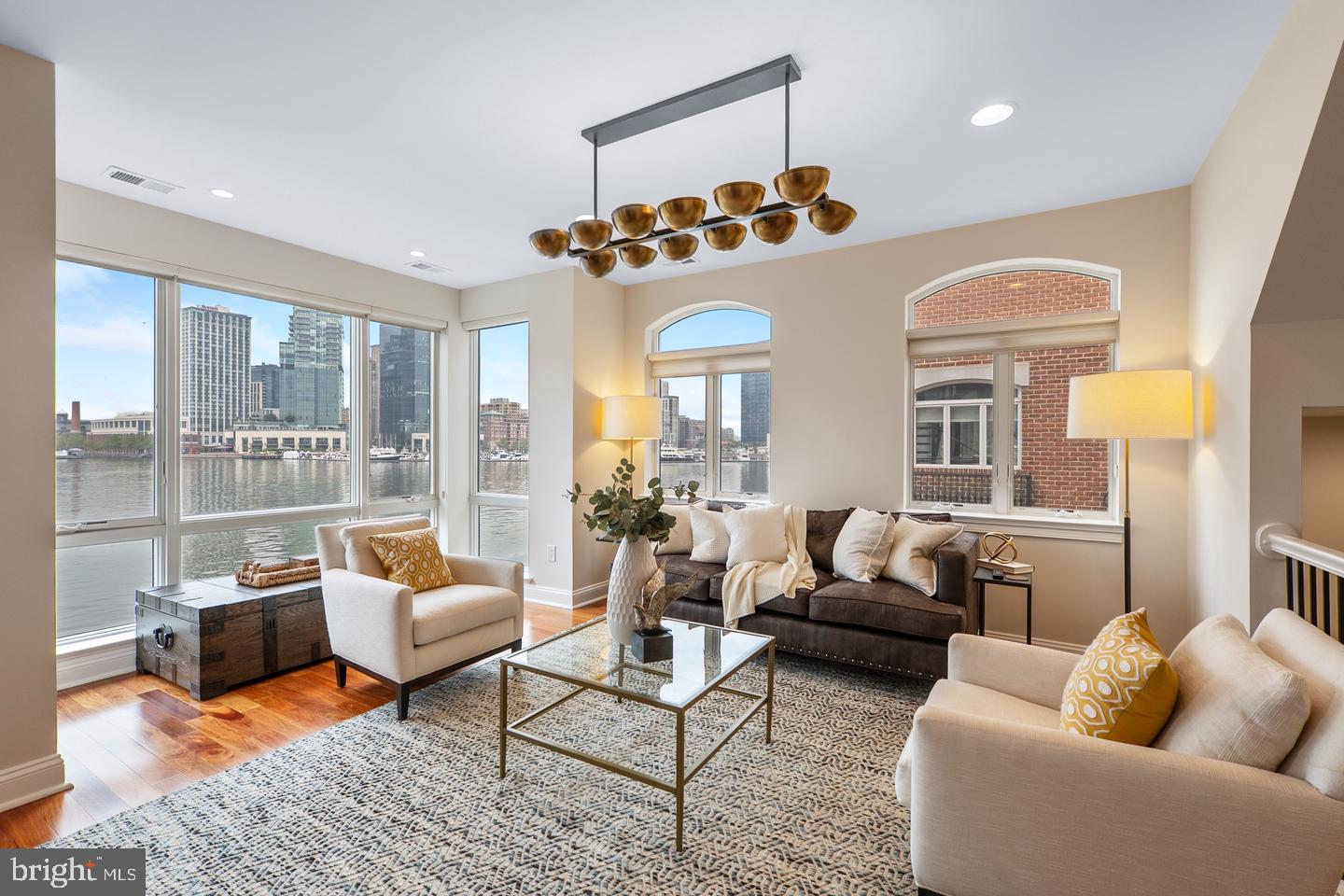 ***Open House - Saturday 1pm-3pm*** A truly exceptional opportunity to own one of Baltimore’s most unique and coveted residences at the Pier Homes at Harborview. 650 Ponte Villas S offers exceptional panoramic harbor views and is in close proximity to Washington DC and Baltimore’s central business district. Minutes from I95, the nations capital and key DC locations are within 35-40 miles by car and easily accessible via the MARC Camden line in 30-45 minutes. The new corporate campuses of T. Rowe Price and Under Armour are minutes away via water taxi, a short walk or drive. Residents enjoy the best of both worlds — serene waterfront living with effortless access to the nation’s capital. This striking four-level townhome at 650 Ponte Villas South offers an extraordinary living experience with unobstructed, stunning views of the Inner Harbor from nearly every room. The seamless connection between elegant interior spaces and the tranquil waterfront setting creates an atmosphere of sophistication, privacy, and serenity rarely found in city living. Enter through a private, secure entrance into the main level, where you will find a private guest suite complete with an en-suite bathroom and convenient elevator access to every floor — ensuring comfort and accessibility throughout the home — and a two-car garage. The next level features an open-concept living space boasting high ceilings, rich hardwood floors, and expansive windows framing the harbor’s waters. The gourmet kitchen features premium stainless-steel appliances, granite countertops, custom cabinetry, and a large breakfast bar — perfect for entertaining. The adjoining dining and living areas — separated only by an elegant double-sided gas fireplace — flow effortlessly toward a private waterfront terrace, ideal for an evening of relaxation while watching boats glide across the harbor. The entire third level hosts a beautifully appointed primary suite offering a sitting area, an additional double-sided gas fireplace, a private terrace, and floor-to-ceiling windows that capture breathtaking sunrise views over the marina. The spa-inspired en-suite bath includes dual vanities, a soaking tub, and a large, separate glass-enclosed shower. A spacious walk-in closet complements the suite’s refined design. The fourth level features an additional flexible social space and outdoor terrace, perfect for entertaining or relaxing, as well as two spacious bedrooms offering generous storage and a well-appointed family bathroom. Take the stairs or private elevator to the spectacular rooftop terrace with wet bar, boasting nearly 1,000 square feet of outdoor living space with jaw-dropping panoramic views — ideal for sunset gatherings or starlit evenings. Residents of the Pier Homes at Harborview enjoy exclusive access to a private, resort-style Health Club featuring a state-of-the-art fitness center, heated indoor pool, whirlpool spa, and sauna — all designed to promote wellness and relaxation. Beautifully maintained waterfront promenades, landscaped courtyards, and a marina setting enhance the community’s tranquil, upscale atmosphere. With 24-hour security and concierge service, residents experience a perfect balance of luxury, comfort, and peace of mind. Living at the Pier Homes at Harborview offers more than a home — it’s a refined lifestyle defined by health, privacy, and spectacular harborfront living. The location puts some of Baltimore’s best-known destinations close at hand. Follow the waterfront promenade toward the Inner Harbor, explore the restaurants and shops of Federal Hill, or visit nearby Federal Hill Park, the American Visionary Art Museum, and the Maryland Science Center. Camden Station and I-95 provide options for travel beyond the city. At home, the harbor remains the centerpiece.