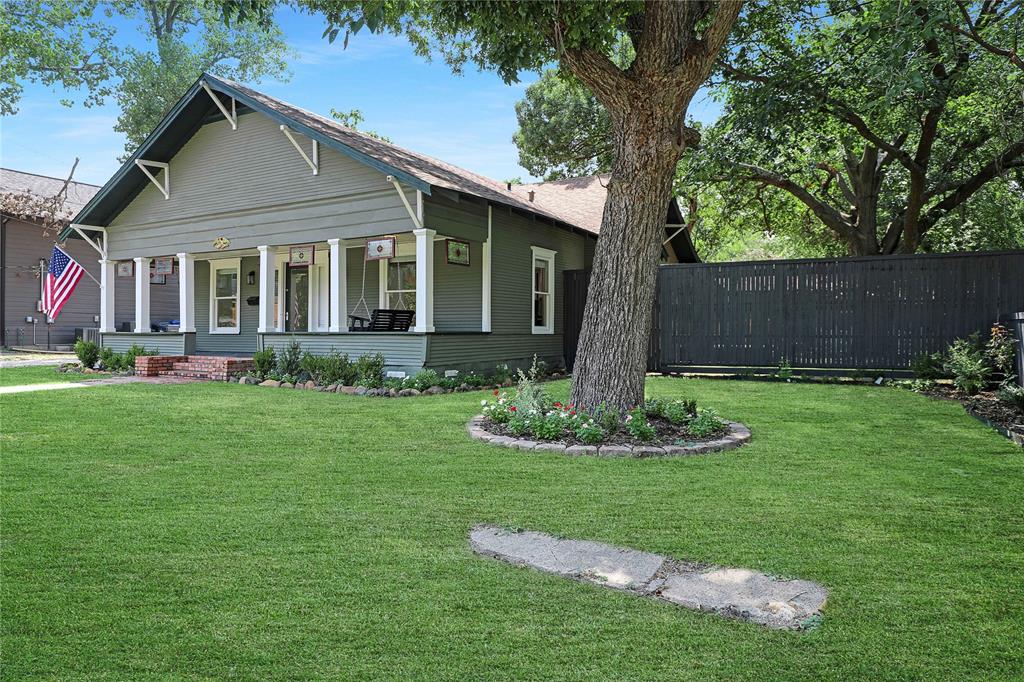 Rare Opportunity in McKinney’s Historic District Area – Two Homes on .48 Acre! Tucked away on a picturesque tree-lined street in McKinney’s beloved Historic District, this stunning property offers two separate homes on an expansive .48 acre lot—ideal for multigenerational living, guest quarters, or income-producing rental. The main home, approximately 2035 square feet, is a beautifully updated circa 1930, 3-bedroom, 2-bath Craftsman-style residence with a wide, welcoming front porch and classic porch swing. Inside, you'll find  three spacious living areas, refinished hardwood floors, shiplap walls, and designer lighting that complement the home’s timeless appeal. The inviting living room features an original  decorative oak fireplace mantle, adding a charming character to the space. The gourmet kitchen is outfitted with quartz countertops, custom cabinetry, a DCS 6-burner gas range with double oven and a pot filler on a timeless subway tile backsplash. Both bathrooms feature antique vanities that bring vintage charm to the thoughtfully renovated spaces. The primary ensuite also includes a custom walk-in closet and a spa-like bath with an oversized marble shower with dual shower heads. Step outside to the lovely deck, perfect for outdoor dining, while twinkle lights in the spacious backyard create an enchanting evening ambiance. Perfect size to add a pool! A garden shed and  2-car carport completes the main residence, along with an oversized driveway with plenty of room to park all of your toys, boats, campers, RV's,and ATV's! The second home (784 sq ft) offers privacy with a separate entrance, full kitchen with stainless steel appliances, shiplap walls, two bedrooms, or an office and a spacious full bath—perfect for extended family, guests, or rental income. With space, charm, and flexibility in one of McKinney’s most desirable neighborhoods—just minutes from the Historic Square—this rare offering is a true gem!