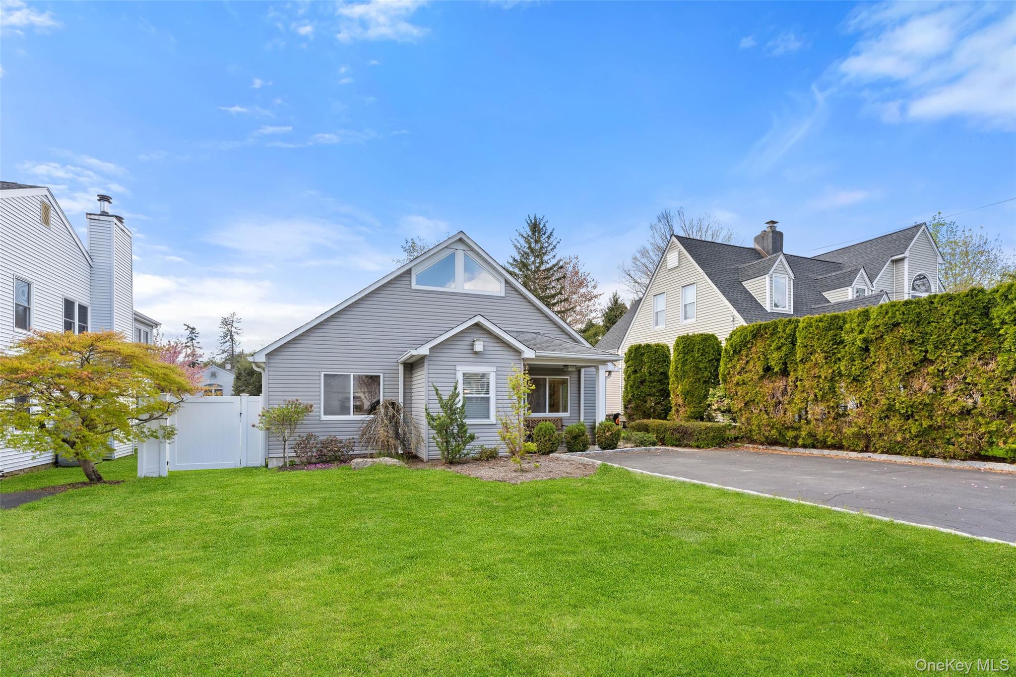 Welcome to this stunning Armonk gem, ideally situated on one of the town’s most sought-after streets. Just moments from the elementary school and the heart of town, this home offers the perfect blend of charm, convenience, and community.This thoughtfully designed home features four spacious bedrooms and three full bathrooms, all conveniently located on the main level. Step inside to soaring ceilings and an inviting open layout that feels both airy and welcoming.Upstairs, you’ll find a versatile bonus space—perfect for a home office, study area, or creative retreat—along with ample storage to keep everything neatly organized.The main-level primary suite showcases high ceilings, generous closet space, and a luxurious en suite bathroom. Two additional bedrooms share a beautifully renovated bath, while the fourth bedroom features its own private en suite.Step outside to your own fenced-in backyard oasis—ideal for relaxing or entertaining.Don’t miss the walkout basement, offering endless possibilities for recreation, a home gym, plus abundant storage to meet all your needs.This home truly has it all—comfort, style, and a prime location. Don’t miss your chance to make it yours!