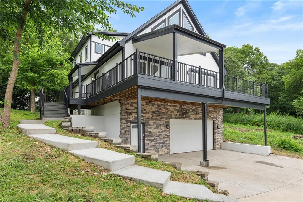 Experience serene lake living in this updated two-story home with stunning lake views and spacious open areas. The main level features a kitchen, living, and dining combo with soaring vaulted ceilings, while a large deck is perfect for entertaining or enjoying your morning coffee. The primary suite has its own floor, complete with two walk-in closets, a laundry hookup, and a spacious ensuite with a shower and tub. The lower level includes a renovated full bath, a cozy family room, and a wet bar area. The garage offers high ceilings for ample storage. This second-tier lake home is truly a must-see! HOA Fees, square feet and taxes are estimated. Buyers agent to verify. All offers are subject to a 15-day right of first refusal. Buyer to pay a HOA transfer fee at closing.