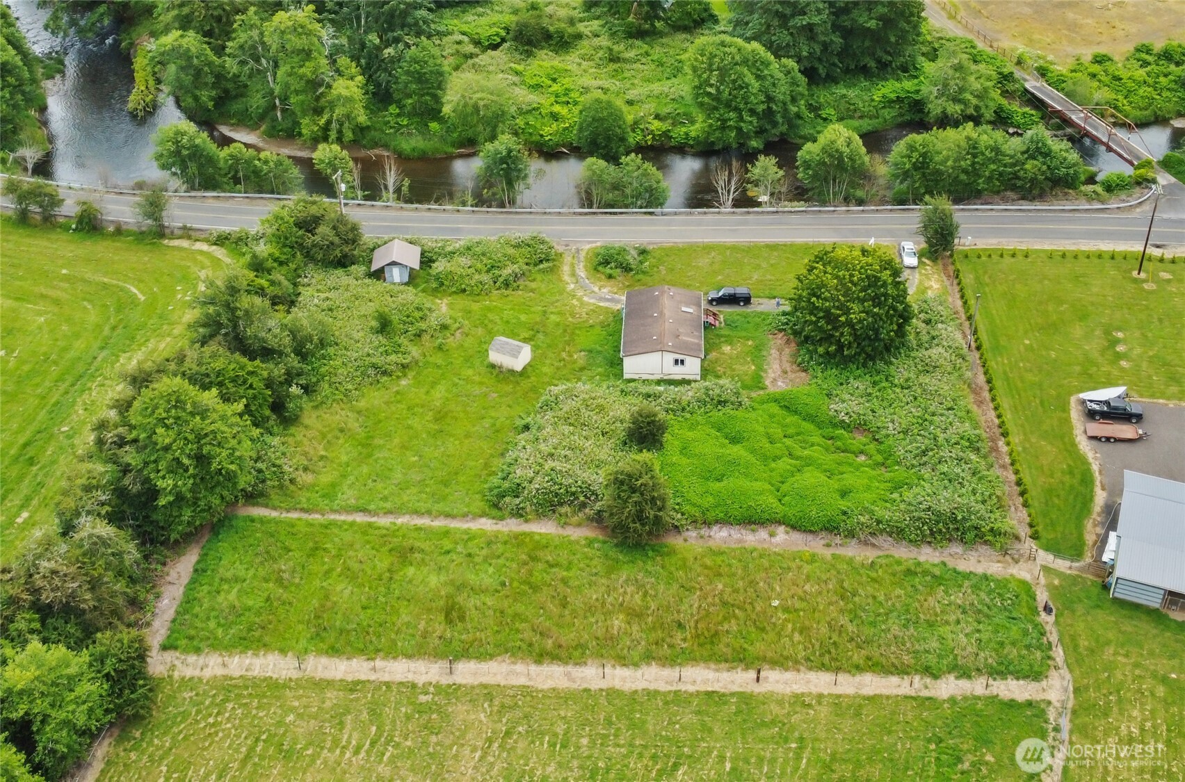 1.3 acres right across from the Elochoman River with a great opportunity to build your dream home! Septic has just been pumped and inspected and is good to go.  There's a one-year-old storage shed with room for tools or equipment. The current home is a 3bed/2bath manufactured home and is in need of significant repairs. The well on the property no longer provides adequate or quality water, there is a 300-gallon reservoir tank that can be filled by a service as needed. The property is being sold as-is and the value is in the land. With room to garden, play, or unwind and fish across the street, this acreage offers the tranquility of rural living while still being within reach of town amenities.