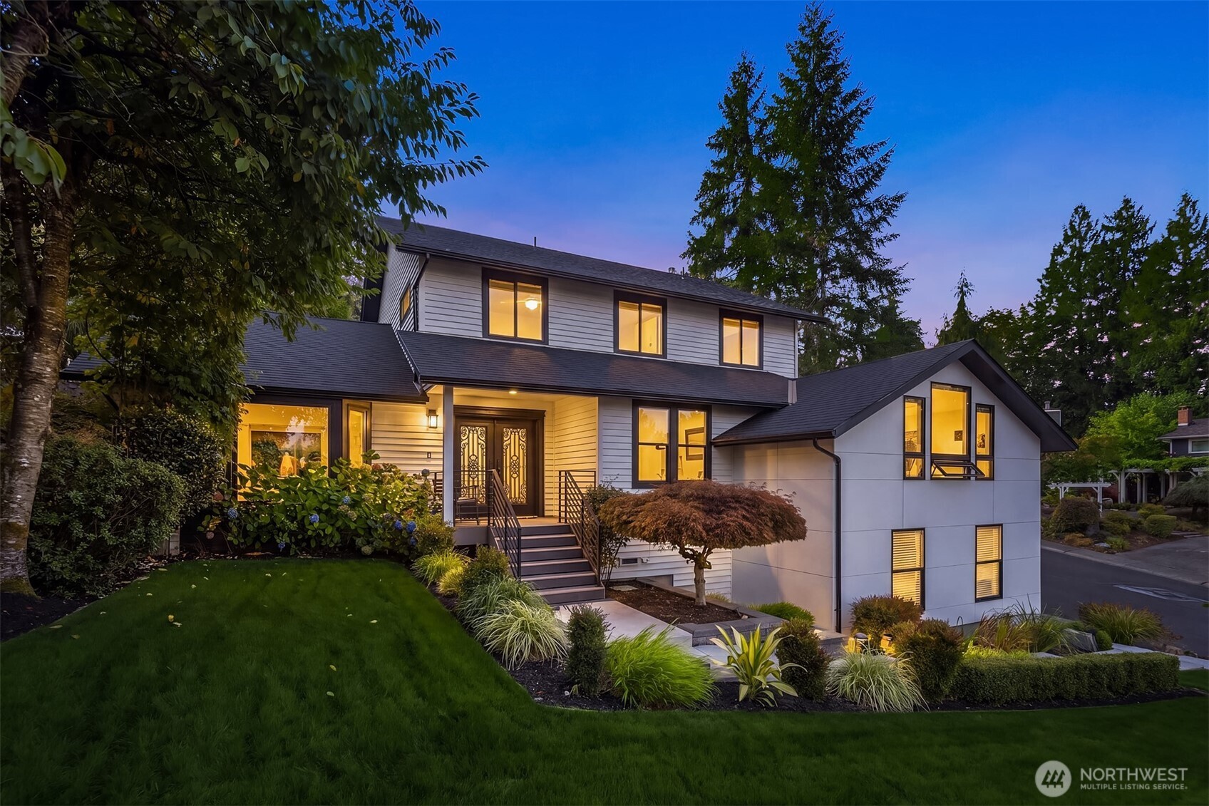 Welcome home to 41Point5, a hidden Bellevue gem nestled directly across from Lake Sammamish. This stunning, fully remodeled home features more than $600,000 in designer upgrades and offers a truly turnkey lifestyle, with every inch thoughtfully reimagined. Entertain effortlessly from the custom living-room wet bar, complete with a beverage fridge, ice maker and nickel sink. The chef’s kitchen impresses with premium Thermador and Miele appliances, an induction cooktop, steam oven, integrated Thermador espresso maker and a pantry with custom built-ins. Multiple living and dining spaces, a powder bath and dedicated laundry room add everyday ease. A main-level office and ensuite bedroom with white oak herringbone floors offer exceptional flexibility for guests, multigenerational living or an additional bonus living space! Upstairs, the serene primary suite features Lake Sammamish views, a five-piece bath with freestanding tub, floating walnut vanity and walk-in closet. Two additional bedrooms and a full bath complete the upper level. Outside, enjoy a private, lush backyard with lawn space, irrigation and an expansive composite deck made for grilling, entertaining or watching boats and eagles pass by. Complete with a two-car garage and convenient access to I-90, Microsoft, Downtown Bellevue, Seattle and T-Mobile. Enjoy nearby public lake access or join Vasa Park for even more opportunities to experience life on Lake Sammamish.