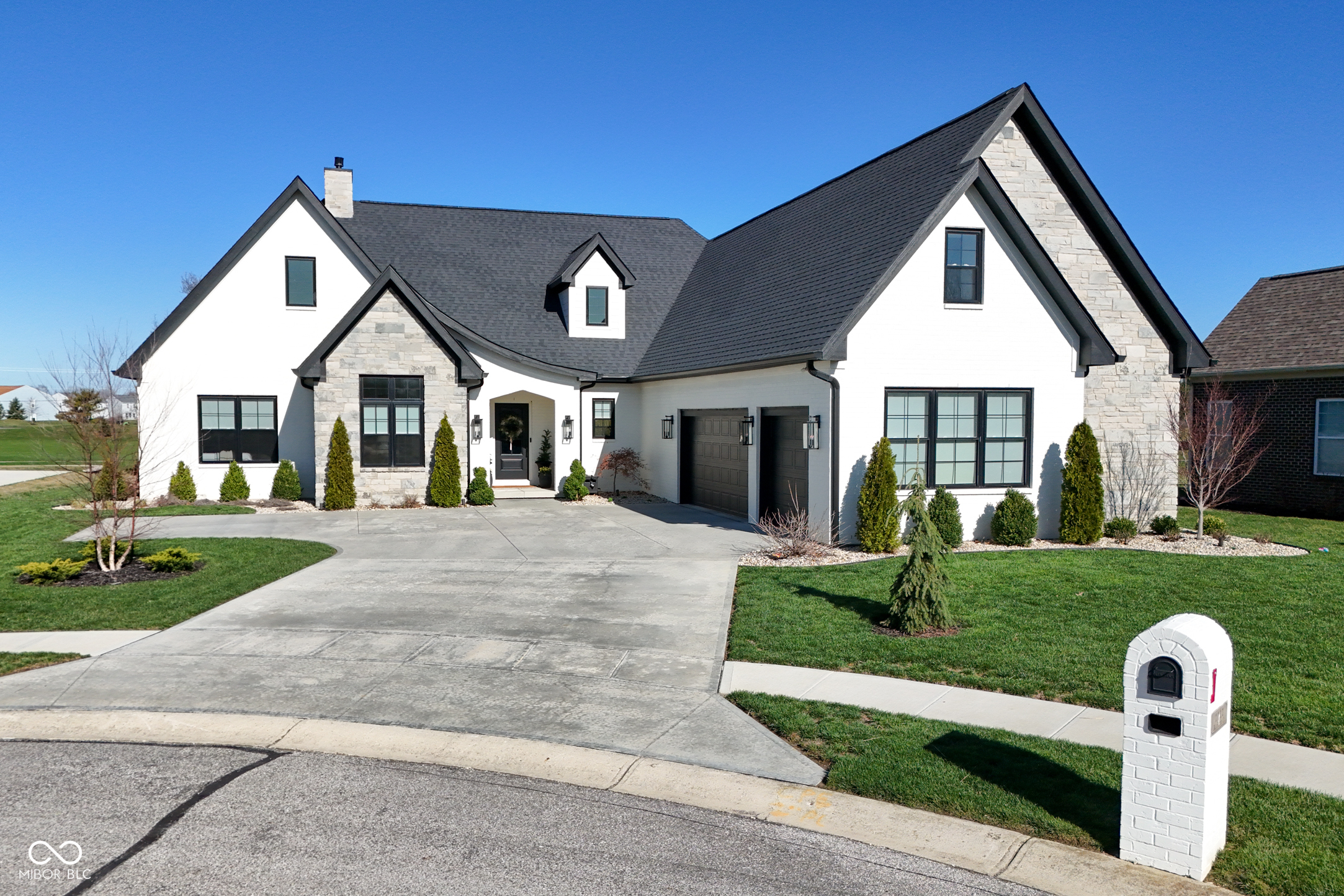 Discover luxury living on the Legends Golf Course in this better than new home that delivers unforgettable style and comfort. The open floor plan showcases a stunning living room with wood beams and soaring 12 foot ceilings that flow into a bright, upscale kitchen built for both everyday living and effortless entertaining. With 4 bedrooms and 3 bathrooms, the home offers generous space for family and guests. Step outside to an entertainer's paradise featuring an outdoor bar and grill, a cozy fire pit, and breathtaking sunset views over the course. Inside, a private home theater turns movie nights and game days into a true experience. Just minutes from downtown, this home blends peaceful golf course living with quick access to restaurants, shopping, and community events. High-end finishes, thoughtful design, and exceptional indoor/outdoor living make this property a standout for buyers seeking something truly special.