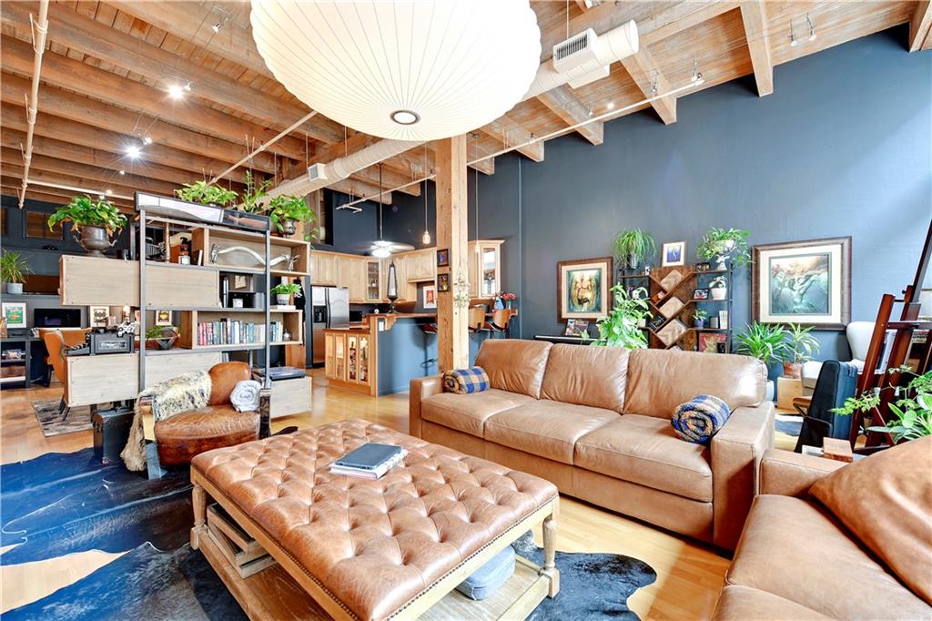 This is a wonderful opportunity to own a beautifully remodeled condo in the historic SOHO West building. Massive 1500+ square foot unit with loads of natural light and accented by twelve foot ceilings. Open floor plan features newer floors throughout, exposed brick walls, wood beams + tongue and groove ceilings. Layout easily accommodates a large living room, formal dining and bonus office area. Spacious kitchen features granite counters, loads of cabinet space, stainless appliances &  eat-in breakfast bar.  Well appointed bathroom with large shower/tub  plus double vanity  with great storage. Master bedroom recently enclosed with French Doors to allow natural light and walk-in custom closet. Laundry conveniently located in hallway closest. Additional storage room is located on same floor as condo with ample storage space and built-in shelving. Indoor parking space is included. 

SOHO West is a classic, boutique building located between Kansas City’s Rivermarket and Central Business District. Easy street car access to Power & Light for entertainment, local dog parks, KC Current stadium and more!