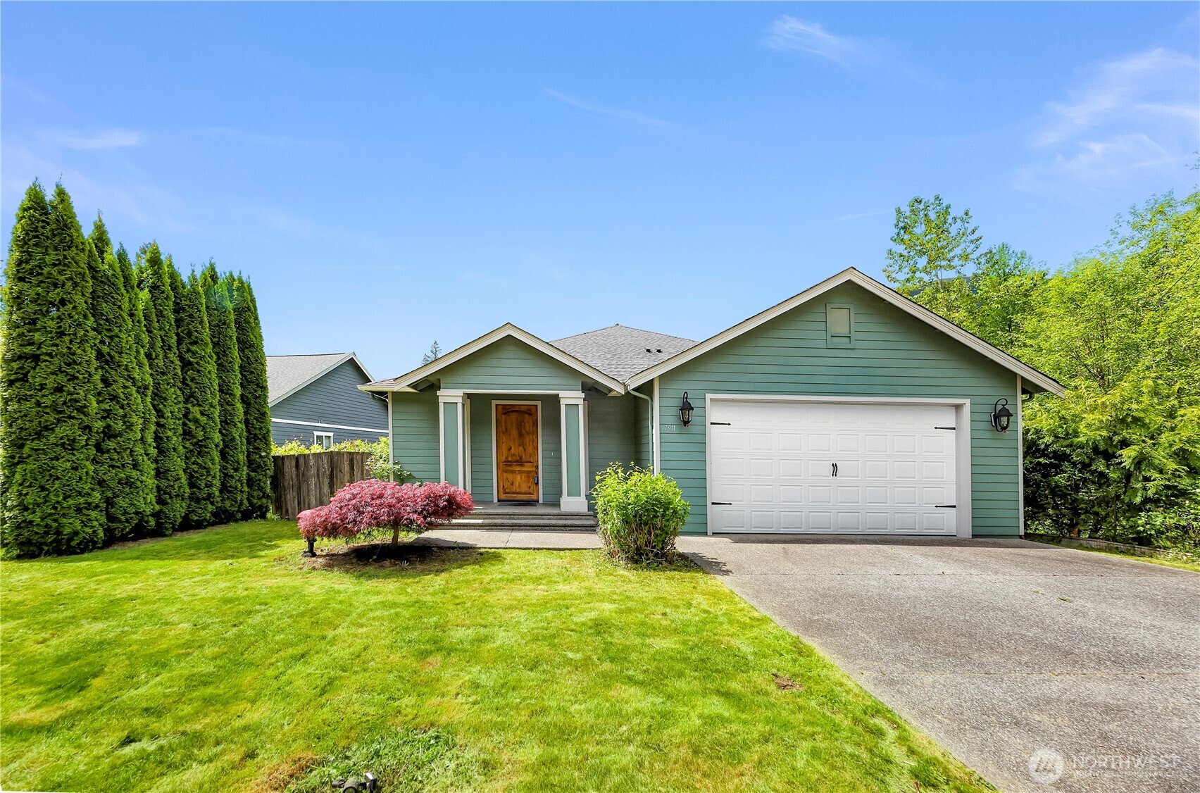 Beautifully built custom single-level home with mountain and territorial views in a quiet Maple Falls neighborhood. Enjoy a spacious layout with a large front entry, living room, and family room with a cozy stone gas fireplace. Lots of big windows for natural light. The kitchen offers solid granite counters, stainless appliances, pantry, and abundant cabinet space. Primary suite features a walk-in closet, soaking tub, and separate shower. Includes 9’ ceilings, crown molding, travertine-style tile floors throughout, laundry room off the garage, washer & dryer included, fully fenced yard, storage shed/shop, two-car garage with air and power hookups, long flat driveway, and newer exterior paint. Move-in ready!