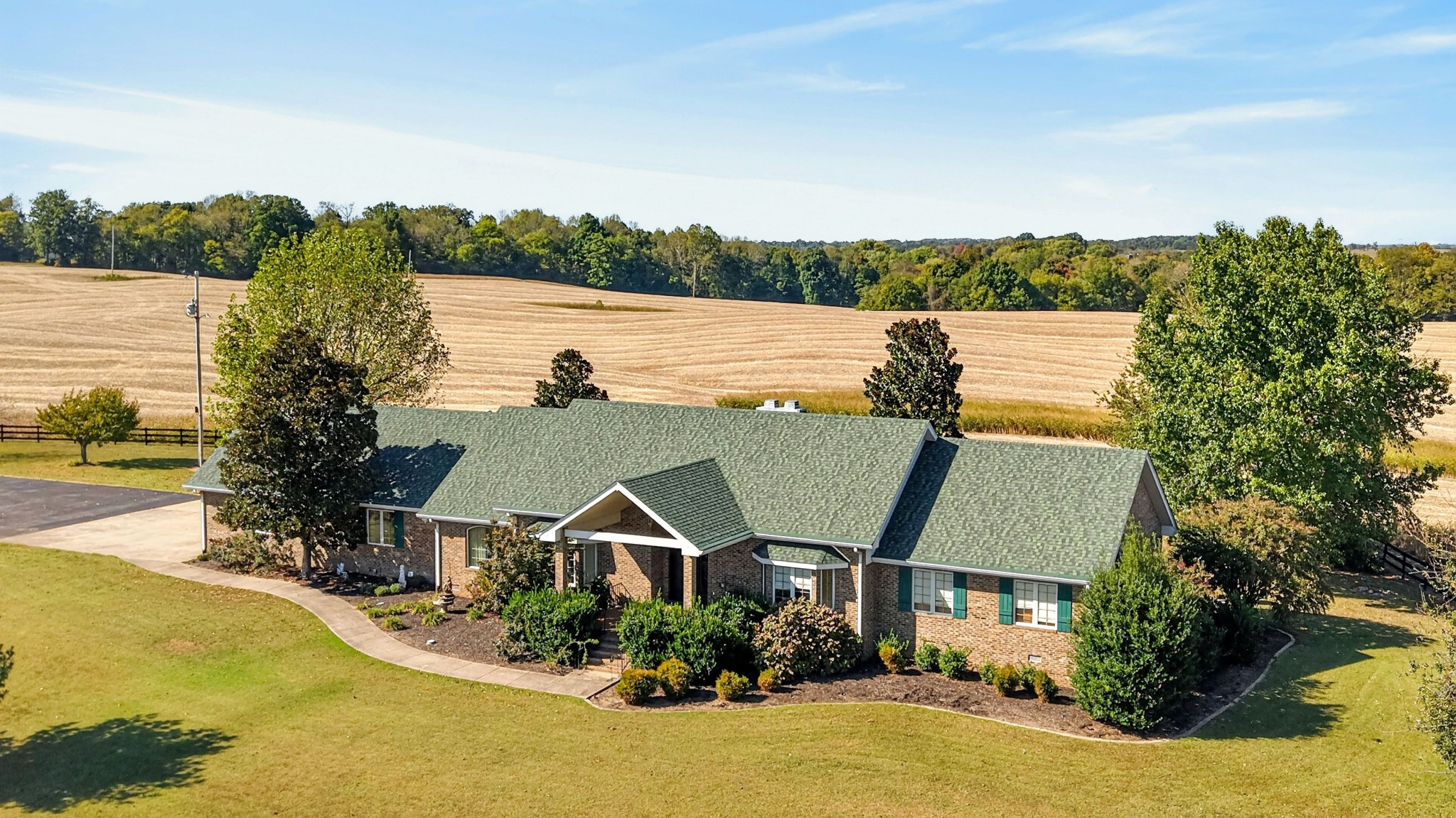 Luxury, Privacy, and Resort-Style living come together in this stunning All Brick Ranch Home: This impressive 3-bedroom, 3.5 bathroom property offers approximately 3446 sq. ft. of beautifully designed living space, From the moment you step inside, you'll appreciate the spacious open layout, upscale finishes, and oversized windows that fill the home with natural light while capturing the nearby Acreage with Bountiful Views,  At the heart of the home is a gourmet kitchen designed for entertaining, featuring high-end Stainless Appliances, The Home features, Built in Cabinets & Bookshelves, Great Room w/ Fireplace, Hardwoods, Central Vac. System, Water Filter System, City Water, Paved Drive, 2 Car Garage, and Home Generator. Also Enjoy your own private backyard retreat featuring 5 acres with Lexington Style Fencing with Beautiful Landscaping, Offering plenty of room for entertaining, relaxing, and enjoying the Morning Sunrises or Evening Sunsets.