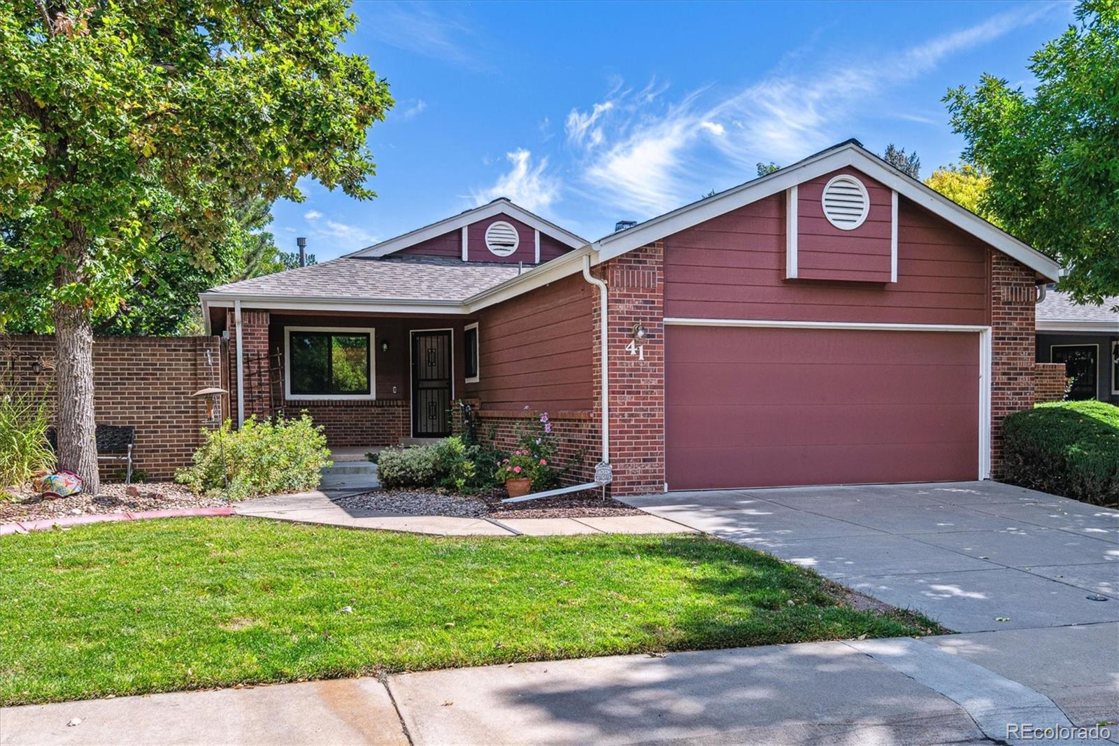 HUGE Price Reduction! Your Dream Patio Home Awaits. Ready to live your best low-maintenance life? This gem in the sought-after Ridge at Tamarac is calling your name! Picture yourself strolling down peaceful streets, sipping your morning coffee, & basically living the dream. Here's what makes this place amazing: Seller is offering up to $10,000 for Buyer's Interest Rate Buydown! Generous family room w/inviting wood-burning fireplace flows seamlessly into the dining area. Bathed in natural light thanks to vaulted ceilings, skylights, & large windows—step through the slider to your private/tranquil backyard. The kitchen checks all the boxes: granite counters, cherry cabinets, black appliances, & a pantry that actually fits your groceries. Enjoy meals in the adjacent eating area-the bay window overlooks your outdoor space. Spacious primary bedroom suite w/5-piece bath & generous walk-in closet. Sun-soaked secondary bedroom w/ skylights & vaulted ceilings—home office by day, guest room by night! Convenient main floor laundry. Main floor full bath adjacent to secondary bedroom. Hunter Douglas blackout shades throughout. The basement level delivers serious square footage with a generous great room ideal for entertainment and relaxation. Sizable bedroom boasts egress window & walk-in closet, complemented by a full bathroom directly across the hall—a thoughtful layout for guests or multi-generational living. Two oversized storage areas provide abundant room for seasonal items and more-or need another bedroom? Possibilities are endless. Step outside to your private oasis! This inviting space comes complete with a retractable awning, established landscaping & a relaxing water feature. Two-car attached garage with an exterior access door. The HOA takes care of all the exterior work—roof(replaced 2024), paint, sprinklers, lawn care, & snow removal. This home delivers on comfort, quality, and that hard-to-find peace of mind.