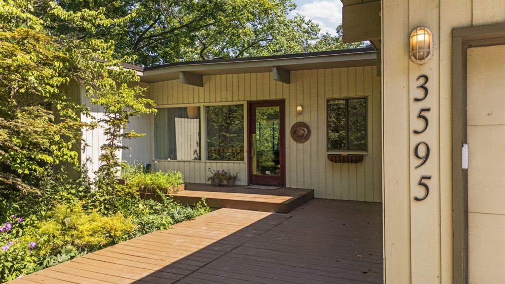 Remarkable Mid-Century Modern in the Heart of Ann Arbor. This extraordinary home offers a private retreat overlooking the South Pond of the Huron River--all just minutes from downtown, the hospital, shopping, restaurants, and everything Ann Arbor has to offer. The setting is so peaceful, it's easy to forget you're still in the city. Inside, you'll find natural hardwood floors, slate entry and kitchen flooring, and brand-new carpet in the bedrooms that create a warm, inviting atmosphere. With 3 bedrooms, 2.5 bathrooms, 2 kitchens, 2 fireplaces, dual furnaces and central air units, plus a 2-car garage, this home perfectly blends style and functionality. Built-in bookshelves and a dedicated office nook add character and convenience, while expansive windows frame breathtaking views that bring a sense of calm into every room. Sip your morning coffee on the private deck, or unwind on the walkout patio below--ideal spaces to soak in the natural beauty that surrounds this remarkable property