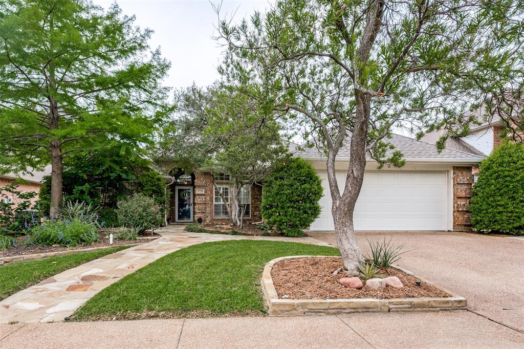 Beautiful one-story River Forest home on a cul-de-sac lot in a prime midcities location. Gorgeous curb appeal with flagstone & brick exterior. Upon entering, there are two spacious living areas, open formal dining area and wood floors throughout. Plantation shutters & crown molding create a custom & warm space. The inviting & modern double-sided see-through glass fireplace separate the living from the kitchen & family room. Recently renovated kitchen with quartz countertops, breakfast bar, updated cabinets, stainless appliances, & breakfast area. Nice corner cabinet in family room is perfect for extra storage.  No carpet in this home makes for a low maintenance updated layout.  Primary bedroom has outdoor access, high ceilings & large primary bath with double vanity, jetted tub & oversized walk-in frameless shower. Three additional bedrooms are perfect for growing family or to be used as a study. The backyard is a private setting with flagstone sidewalk, covered patio, landscaping & mature trees. Adorable, covered pergola addition is great for lounging and enjoying outside. Roof replaced 2024.
