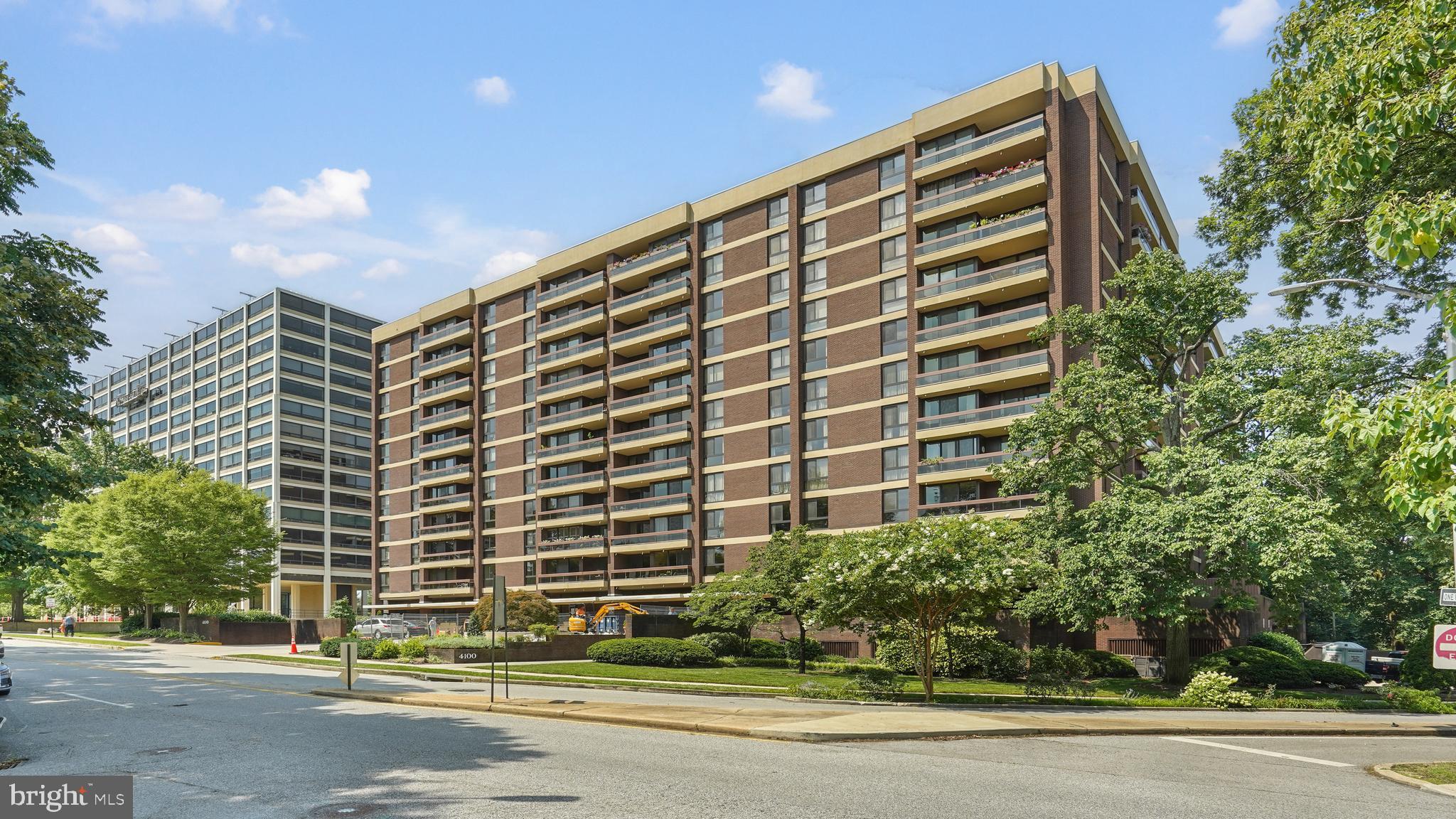 Step into the largest condo in the building, where stunning skyline views and full-service living combine for the ultimate city lifestyle. As you enter, warm wood parquet floors guide you through an expansive layout designed for both comfort and entertaining. The spacious living room offers panoramic views you’ll never tire of—perfect for relaxing or hosting friends. Just beyond, the dining room provides ample space for memorable dinners, complete with abundant storage for all your serving pieces and glassware. The kitchen is a chef’s delight with generous cabinetry, extensive prep space, and stainless steel appliances—ideal for preparing a gourmet meal or a casual brunch. A versatile den with built-in storage and a desk offers a dedicated space for work, hobbies, or displaying your favorite keepsakes. Your guests will appreciate the convenience of a full bathroom with a shower just off the main living area. The primary suite is a true retreat, featuring floor-to-ceiling windows that fill the space with natural light, multiple closets, and an en-suite bathroom with a long vanity and walk-in shower. An additional bright and spacious bedroom and a second full bath—complete with a large soaking tub—offer comfort and privacy for family or visitors. Enjoy morning coffee or evening cocktails on the large balcony, soaking in sweeping city views. This full-service building offers premium amenities, including a community room, sauna, gym, and pool, plus the convenience of an assigned garage parking spot. Here, you’ll find space, style, and service—all in one exceptional home.