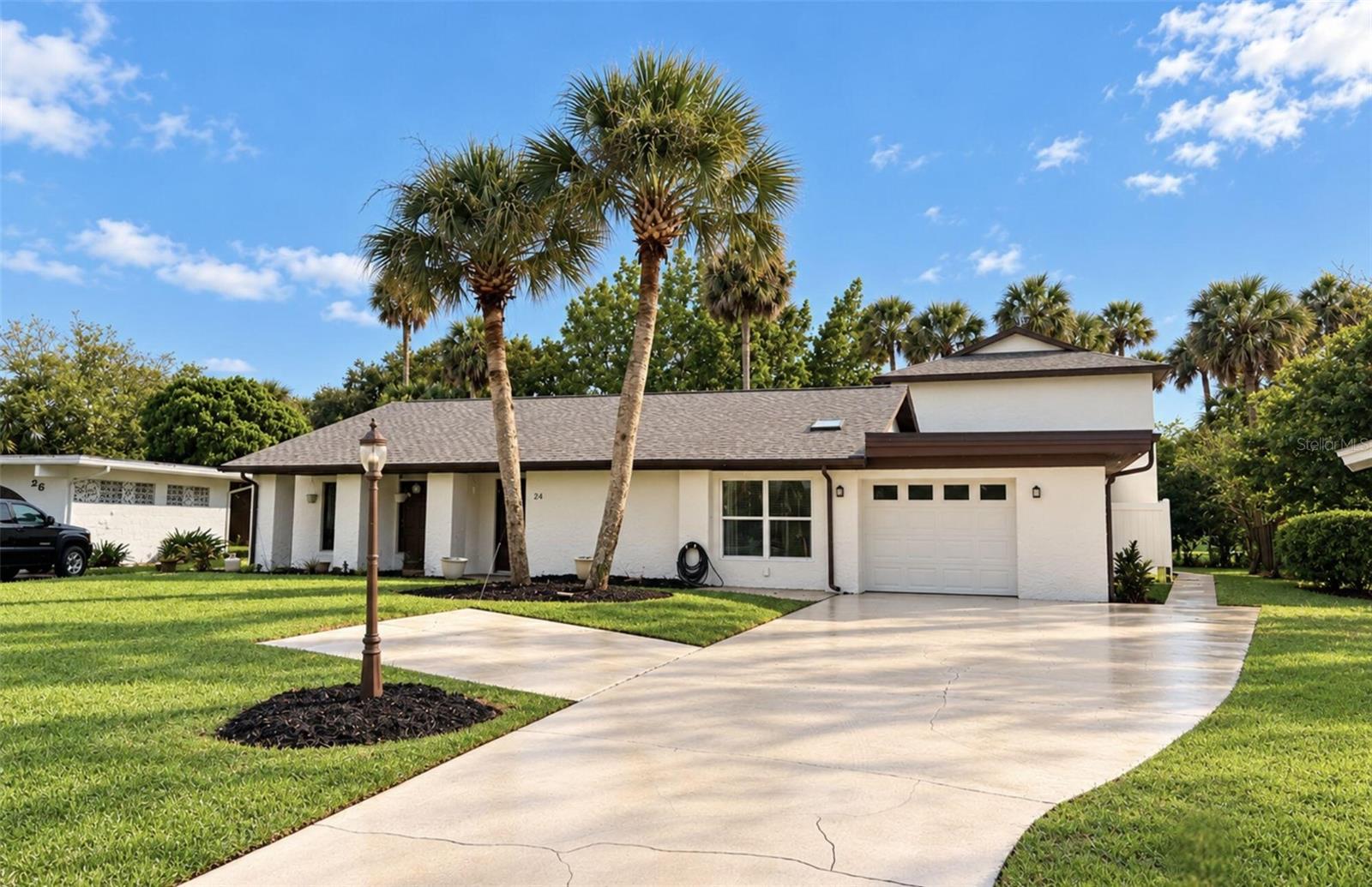 Multi-Generational Golf Course Home!Beautifully maintained 4-bedroom, 3-bathroom home offering approximately 2,870 sq. ft. of living space on the Palm Harbor Golf Course! Situated on a 0.29-acre lot with no HOA, this unique property includes a spacious 1,942 sq. ft. main residence and a private, two-story 928 sq. ft. mother-in-law suite.The attached suite connects to the main home through a lockable interior door, allowing the property to function as one spacious residence or two distinct living areas. The suite also features its own exterior entrance, full kitchen, living room, bedroom, bathroom, walk-in closet, pantry, private laundry, screened upper balcony, and ground-level patio. Great for multigenerational living, extended family, or guests!Numerous updates include a new roof (2022), two HVAC systems (2021), water heater (2022), updated flooring and lighting, and fresh interior and exterior paint (2026). Additional features include whole-house water filtration, an irrigation well and system, and a one-car garage with ample driveway parking.Enjoy peaceful golf course views, walking distance to the golf clubhouse, and a location approximately 10 minutes from Jungle Hut Beach. All appliances convey!Property is being sold as-is. All information is deemed reliable but is not guaranteed. Buyers and their agents are encouraged to independently verify all measurements, property details, and information provided.