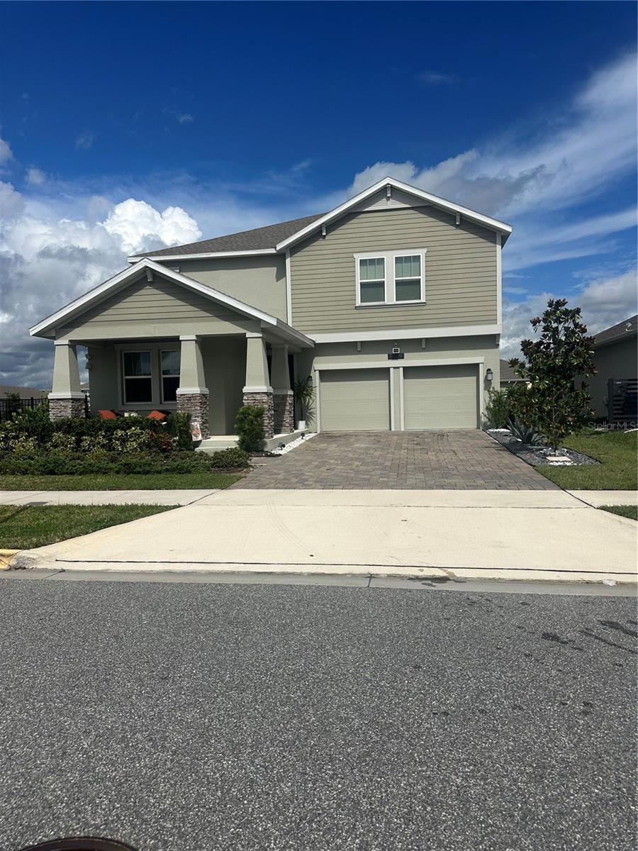 This stunning Peabody model home offers 3,290 square feet of living space, thoughtfully designed for comfort, luxury, and modern living.

The property includes a two-car garage, with the third garage transformed into a state-of-the-art digital podcast studio. Its interiors were decorated by a professional designer, ensuring a refined and stylish atmosphere throughout.

Situated on a corner lot with generous space, this property is perfect for adding outdoor features tailored to your lifestyle. As an added value, the purchase of this home includes a complete 3D design plan for the entire terrace, featuring a swimming pool, full outdoor kitchen, basketball court, BBQ area, and fire pit.
Located in the sought-after Storey Park community, the home is close to the new elementary and high schools as well as Innovation Middle School, with easy access to highways 417 and 528. The community also offers premium amenities, including two pools, a gym, sports courts, and event halls.

Inside, the home boasts 5 bedrooms and 3 bathrooms, with custom-designed closets in the master suite, motorized shades on the first floor, and motorized blackout shades in the master bedroom. Additional features include:

Solar panels (transfer to new owner; $90/month)

Over $50,000 in luxury upgrades and décor

A modern wine room 

Tile flooring downstairs and carpet upstairs

A whole-house water filtration system.

This home truly blends elegance, functionality, and lifestyle—offering not only a move-in ready property but also the vision of your dream outdoor retreat.