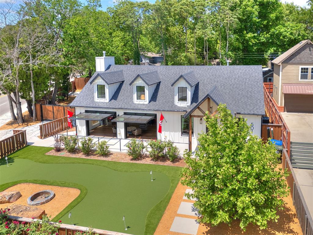 Game Day ABNB property sits on a prominent corner lot just steps from the University of Oklahoma campus—where you can literally see the Memorial Stadium scoreboard from the property. Designed for hosting, comfort, and high-demand short-term rental use, this home blends modern indoor-outdoor living with standout amenities.The spacious great room features vaulted ceilings, a fireplace, and an abundance of natural light. Two impressive vertical-opening doors create a seamless connection to the outdoors, perfect for gatherings on game weekends or everyday living. A full-wall sliding glass door opens to the backyard’s outdoor fire pit, hot tub and living area, extending the entertainment space even further.The fully equipped kitchen offers expansive counter space, abundant cabinetry, bar seating, and a separate dining area, making it ideal for hosting large groups.With four bedrooms and three full baths, the home provides excellent capacity for guests. The front yard includes a custom putting surface and an additional fire-pit area, creating multiple zones for relaxation and fun. The entire lot is privacy fenced and includes two automatic gates, offering secure parking and easy access.A rare combination of location, amenities, and design—this property is perfectly positioned as a premier OU game-day rental, personal retreat, or investment opportunity.