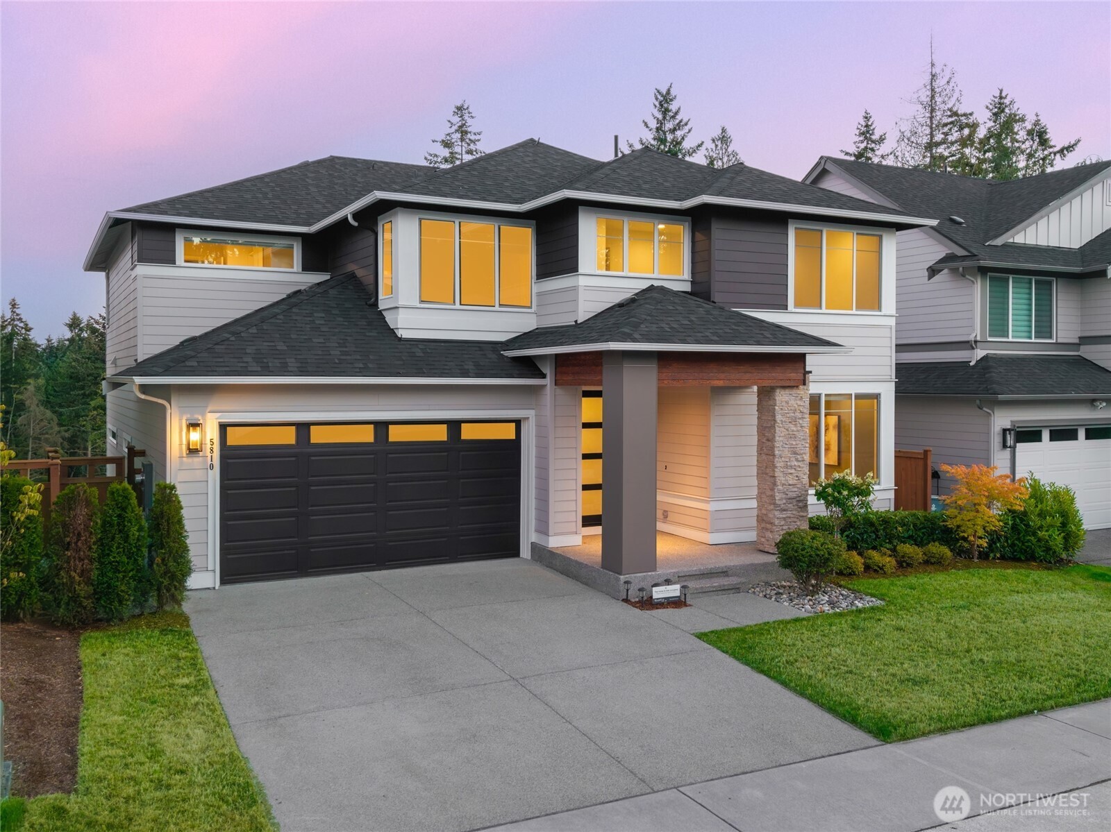 Perched high above the trees with peaceful evergreen views and superior backyard privacy, this modern 2024 MainVue resale (The Indigo plan) in Edmonds offers luxury, natural light, and ultimate layout versatility. Designed with a highly desired south-facing orientation, the Primary Suite, Primary Bath, Great Room, and Gourmet Kitchen are bathed in continuous, brilliant natural light all day long. The main level features open-concept living centered around a signature supersized 3cm Quartz island, European frameless cabinetry, a main floor office with casement windows and motorized blinds, and seamless access to the covered, all-season Signature Outdoor Room with composite decking and a built-in BBQ gas stub. Step outside to a flat, south-facing backyard that feels like a secluded treetop haven. Upstairs boasts 4 spacious bedrooms, a leisure loft with motorized blinds, and a Grand Suite with a designer free-standing soaking tub and walk-in dressing room. The fully finished lower level adds a private 5th bedroom and full bath, creating a dedicated guest suite or multi-generational layout. High-value upgrades include Cat6 Ethernet wiring throughout, smart lighting controls in bedrooms, extra Mineral Wool batt soundproofing insulation in interior walls and floors, high-efficiency HVAC, and a seller-provided 1-Year Home Warranty at closing! Minutes to Meadowdale Beach Park—walk the lush forest trail to the beach after touring this PNW sanctuary!