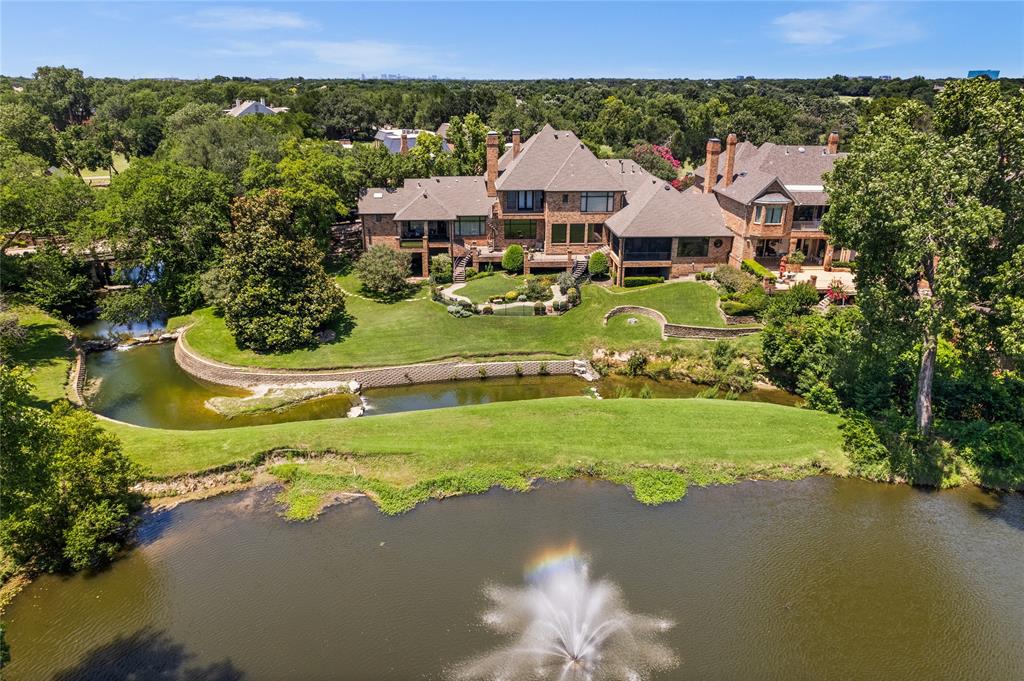WHY NOT ?? LIVE YOUR BEST LIFE TODAY !! This home has an architectural pedigree in a neighborhood with a strong reputation.. Luxury living is not confined to a single image-this home is a mixture of creative energy and a vibrant atmosphere. Be transported to another world by the  outside spaces of cascading lawns - running streams - a peaceful pond and  the  always drop dead views of the 16th hole of the Preston Trail private golf course and Bent Tree Country Club- all belong to this address. If yearning for your own private retreat with an emphasis on wellness and self care - make this  your sanctuary of inspired spaces - blended Southern spirit and charisma with BOLD traditional comforts. In recent years there have been over $400,000 dollars spent on amenities and property improvements. Included in the list are :  HVAC  $10,000 condenser & 5 ton Comfort 16 complete system $22,544 ; Den furnace $4,000 ; Sprinkler Drip installation and app controller $11,000 ; Retaining walls in the stream $126,000 ; Fountain in the pond $10,000 ; Outside Kitchenette Barbecue with granite counter tops $6500 ; refinished wood floors in major areas $24,000 ; Karastan carpeting $13,000 ; Tankless water heater $6500 ; Powder Bath $ 8500 ; the list continues and is available - The unique stunning architecture has been designed using the highest quality of materials. The flow between the inside and outside is an intentional design. All rooms branch from the central great room and dining room with a 40 foot long hall with soaring glass walls. IF needed -3 master suites- perfect for a multigenerational footprint - 6 living areas - massive storage and custom closets - outside living rooms - a beautiful  china display butlers pantry - furniture grade  bookcases and cabinetry - sun filled gathering rooms - exercise areas - viewing and relaxing reading and outside eating balconies - all make up this signature magical beautiful home. Do not miss this once in a generation ownership opportunity.