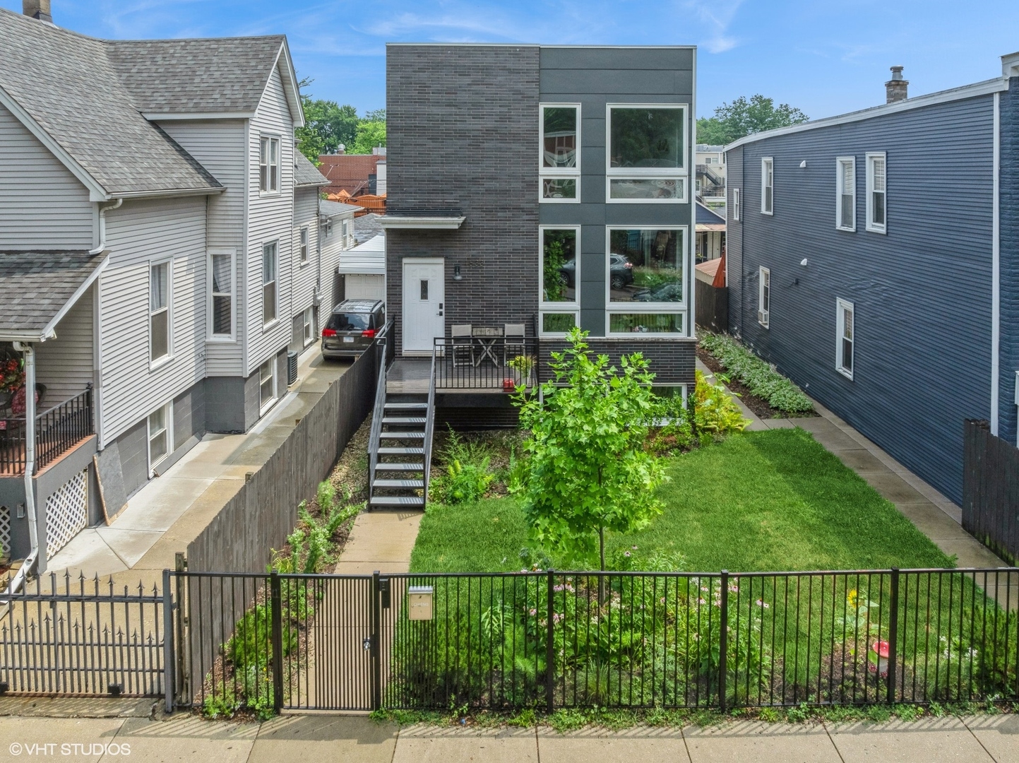 Welcome to your dream home! This stunning single-family residence boasts a bright and airy open floor plan, ideally situated just steps from the vibrant 606 Trail and the picturesque Humboldt Park. Built in 2016, this property features 4 spacious bedrooms, 3.5 luxurious baths, and a convenient 2 car garage, all on an expansive 177-foot lot with unique dual front and back yard spaces. Nestled on a tranquil, tree-lined street that marks the border between Logan Square and Humboldt Park, this home offers the perfect blend of both neighborhoods' charm. The light filled main floor is adorned with beautiful hardwood floors and showcases a large kitchen designed for entertaining, complete with a stunning quartz island, integrated appliances, two pantries, and a wine fridge. Ascend to the third floor, where you'll find three bright bedrooms and two full bathrooms, including a primary suite that is a true retreat, featuring a walk-in closet, a spa-like waterfall shower, and a separate soaking tub. The finished basement level adds even more versatility, offering a large entertaining area, laundry room, a full bedroom, bathroom, and walk-in closet-ideal for a guest room or a home office setup.  Additional highlights include a utility room equipped with a washer/dryer and utility sink, a Nest thermostat, and a wired doorbell/video monitoring system for peace of mind. The 2 car garage is not only functional but also includes a custom-built workbench and attic space, perfect for weekend projects.    Enjoy a lifestyle of convenience with the 606, Humboldt Park, a public library, and the Kimball Art Center all just moments away. Plus, the bustling Armitage restaurant strip is nearby, providing endless dining and entertainment options. Don't miss the chance to call this remarkable property your home!