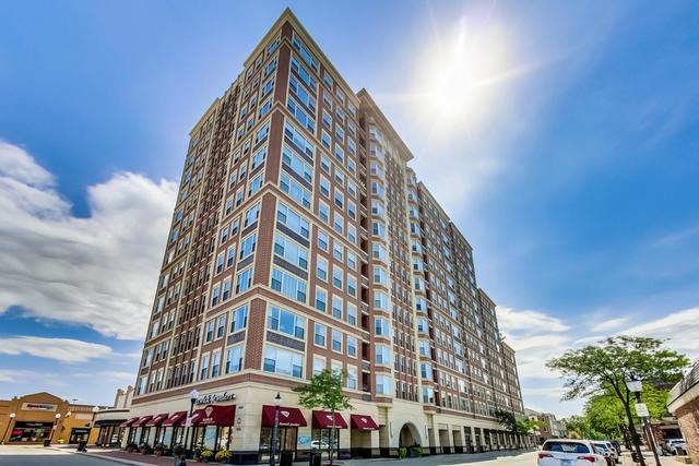 Welcome to 77 S. Evergreen, Unit 803 - a beautiful Eighth-Floor Condo in the heart of DOWNTOWN ARLINGTON HEIGHTS, in a sought-after Premium Condo Building with Concierge Doorman and Heated Parking Garage. Windows galore and TONS OF LIGHT - this 2-bedroom, 2-bath condo offers STUNNING EAST-FACING VIEWS of the CHICAGO SKYLINE, best enjoyed from your private balcony right off the kitchen.  Inside Lofty 9-foot ceilings and Hardwood Floors throughout, with a large living room and dining room perfect for entertaining. The open kitchen offers space for a kitchen table and has granite counters, white cabinetry, and abundant storage. In-unit laundry makes everyday living easy. The primary suite features a walk-in closet, double sinks, and a separate tub and shower. Building amenities include seven-day-a-week concierge service, heated garage parking (space #18), and a fitness center and party room.    Enjoy All Downtown Arlington Heights has to Offer - Restaurants, Bars, Theatre, Shops and Metra all steps away. Dogs and cats welcome (50 lb limit). Home being Conveyed ( As -Is) Storage unit #45 located on 2nd floor with Fitness Center and Party room.