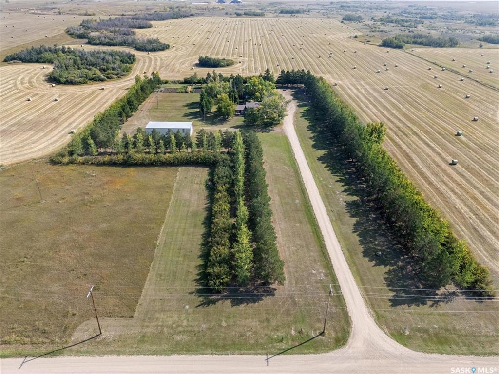Beautiful 10-Acre Acreage – Minutes from Saskatoon & Martensville
Enjoy the perfect blend of privacy and convenience with this mature, tree-lined 10-acre acreage located just 5 minutes from both Saskatoon and Martensville. Nestled in a quiet and serene setting, this property offers ample space, functional outbuildings, and a spacious family home—ideal for anyone looking to live the acreage lifestyle without sacrificing proximity to city amenities.

Home Features:
• 2,153 sq. ft. Two-Storey Home (Built in 1979)
• 3 Bedrooms | 3 Bathrooms (2pc, 4pc, and 3pc ensuite)
• Partially, Developed Basement – Ready for your customization

Utilities & Services:
• 3-Phase Power at the road
• Rural Water Line with drip system, holding tank & pressure system
• Well Water with pump and pressure system
• Additional Garden Well from dugout on adjacent land (with pump & pressure system)

Outbuildings & Extras:
• Shop (20' x 30')
o Insulated with electric heat, in-floor oil change pit, 110V & 220V power, concrete floor
• Quonset (40' x 69')
o Metal construction, 200 amp electrical service, dirt floor
• Garage (16’ x 24’), power, cement floor, lined vinyl/exterior shingles
• Not included in sale: Outdoor pool and portable sauna in the house. Kids' play structures, office trailer and sea cans are also not included in the sale and will be removed prior to closing. 

Please note: Vendor requires a 24-hour notice to show the property.