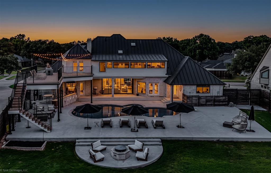 Waterfront homes of this caliber are seldom available, especially on a half acre estate with a 2 acre take line creating a serene private setting. At 28 Victoria, luxury is a lifestyle. Thoughtfully curated landscape design blends beauty and purpose, low-maintenance plants enhance the stunning curb appeal. Inside, effortless elegance unfolds. A two story foyer welcomes you into light filled living spaces where walls of windows frame the pool and lake beyond. The expansive living room with stone fireplace flows into a chef’s kitchen designed for daily living and elevated entertaining, featuring a double oven, gas cooktop, built-in refrigeration, formal dining room and custom wine wall. The master suite is a private sanctuary with a sitting area and fireplace, tranquil water views, beautifully designed bath and custom walk-in closet. A second downstairs bedroom with ensuite full bath offers convenience for a growing family, multi-generational living, or a perfect guest suite. Working from home feels indulgent in the downstairs office, featuring luxurious built-ins and a picture window overlooking manicured grounds and breathtaking waterfront vistas framed by majestic mature trees. When it’s time to unwind, retreat to a perfectly placed hammock beneath the canopy or set off across the lake from your private boat dock.Upstairs, spacious en-suite bedrooms with private balcony access, a second story deck ideal for sunbathing and sweeping views. Outdoors, the experience becomes extraordinary. Whether lounging by the pool and spa, warming by the fire pit, or dining under the stars, this lakeside retreat is a dream. Covered outdoor living space, full kitchen with built in appliances and heaters create an unparalleled setting for year round entertaining.The private dock is fully equipped with a boat lift for effortless access to the water. Set on Lake Ray Hubbard, less than 30-minutes to downtown Dallas, this is a rare opportunity to experience elevated waterfront living.