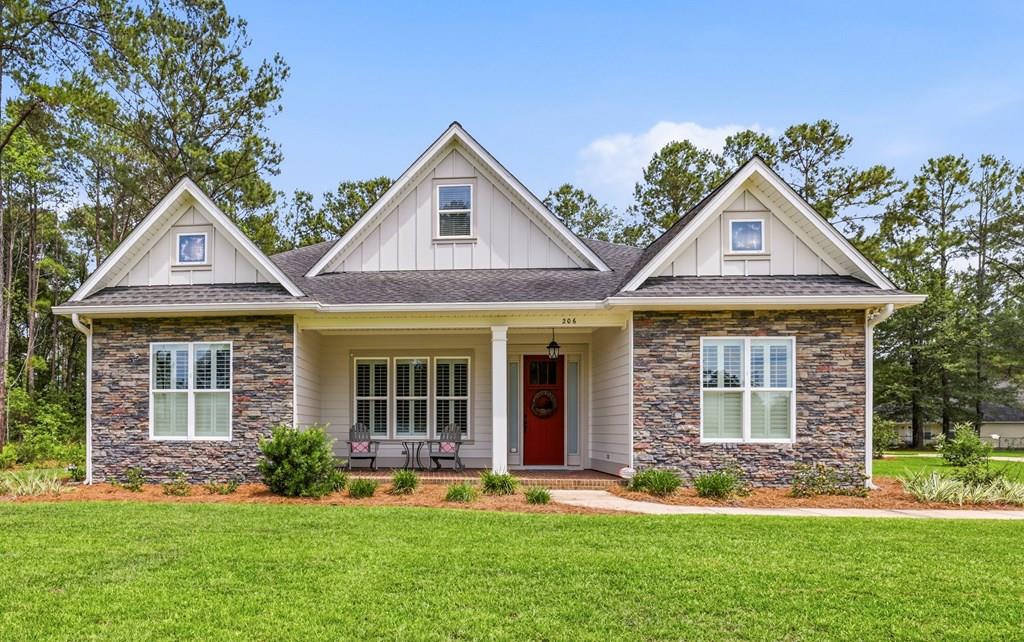 Positioned on a beautifully landscaped 0.82-acre homesite conveniently located near downtown Thomasville, this custom-built residence blends timeless craftsmanship with thoughtful design in one of the area's most desirable neighborhoods. Offering 4 bedrooms, 2.5 baths, and over 3,100 square feet of living space, the home features an open-concept floor plan accented by crown molding, custom wood shutters, engineered hardwood flooring, and elegant judges paneling in the formal dining room. The spacious kitchen is designed for both everyday living and entertaining, complete with abundant cabinetry and seamless flow into the main living areas. The private primary suite offers a spa-like retreat with a tiled walk-in shower, garden tub, and generous proportions. Additional highlights include a large laundry room, exceptional storage throughout, and a 306-square-foot partially finished upstairs bonus space ideal for a home office, gym, media room, or future expansion. Outside, enjoy the privacy and functionality of the expansive backyard , a wired 12x16 storage building, and a two-car garage. Combining quality construction, refined finishes, and an ideal location, this one-of-a-kind property offers the perfect balance of comfort, sophistication, and convenience.