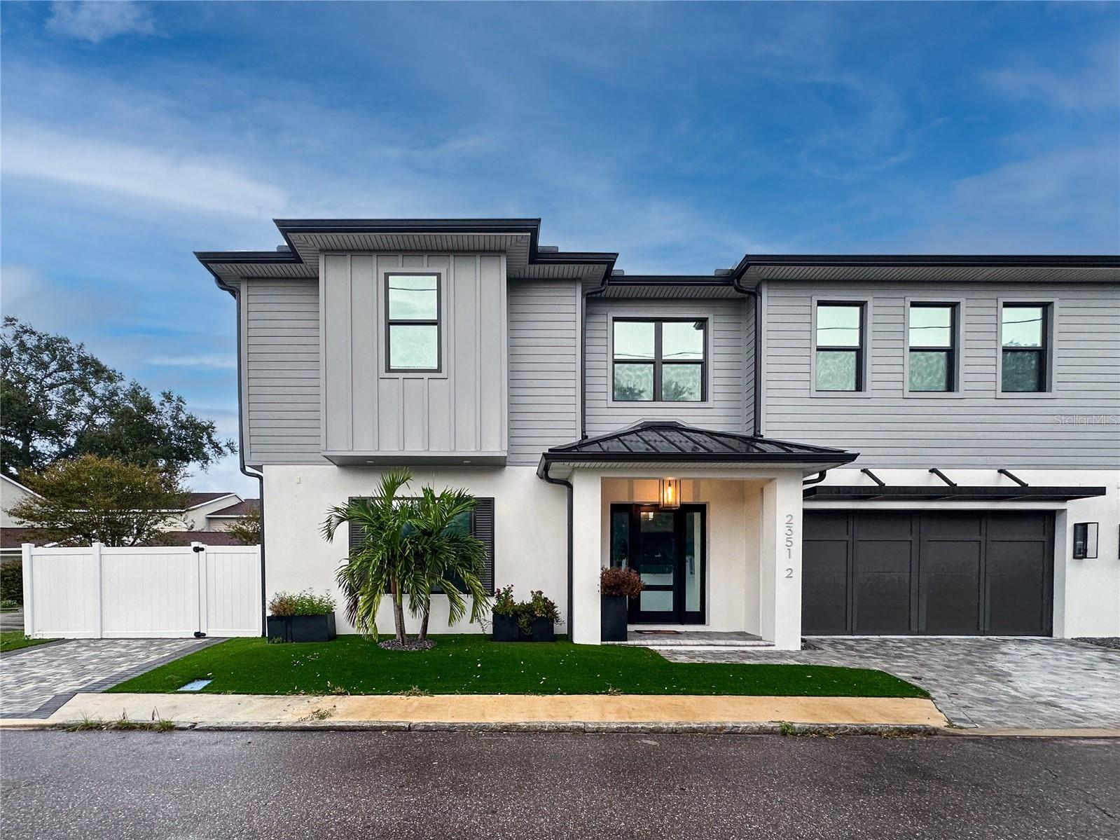 AWESOME LOCATION!! Just off Bayshore Boulevard and walkable to Hyde Park Village & SoHo—this stunning townhome is perfectly situated in one of the most coveted neighborhoods of South Tampa! Built by Brookshire Homes 5-bedroom, 4.5-bath, 2-car garage residence combines luxury, comfort, and exceptional design. Step outside to your custom-designed backyard oasis featuring a heated in-ground pool spa with lights and bubbles, surrounded by low-maintenance turf grass and a paver driveway and walkways for a clean, elegant look. Entertain effortlessly on the covered patio with an outdoor TV, perfect for relaxing evenings or game days by the pool. Inside, the spacious gourmet kitchen is a chef’s dream, complete with a large island, marble countertops, Thermador appliances including a 48" built-in refrigerator, and a Silhouette wine cooler. Walk in pantry and storage room with custom barn door. The first floor offers a private guest suite, while the second floor features a luxurious primary suite with a large walk-in closet and a spa-like bath with a freestanding tub, dual vanities, and a walk-in shower with a bench. Three additional bedrooms, each with walk-in closets, and a convenient laundry room with a sink complete the upper level.Throughout the home, enjoy White Oak 5" hardwood floors, 7-1/4" baseboards, impact glass windows, and 15 SEER split HVAC systems with programmable digital thermostats. This home truly has it all—luxury finishes, thoughtful design, and an unbeatable location just steps from Bayshore Boulevard and the best of South Tampa living! AAA+ rated school district, Mitchell, Wilson and Plant!!!