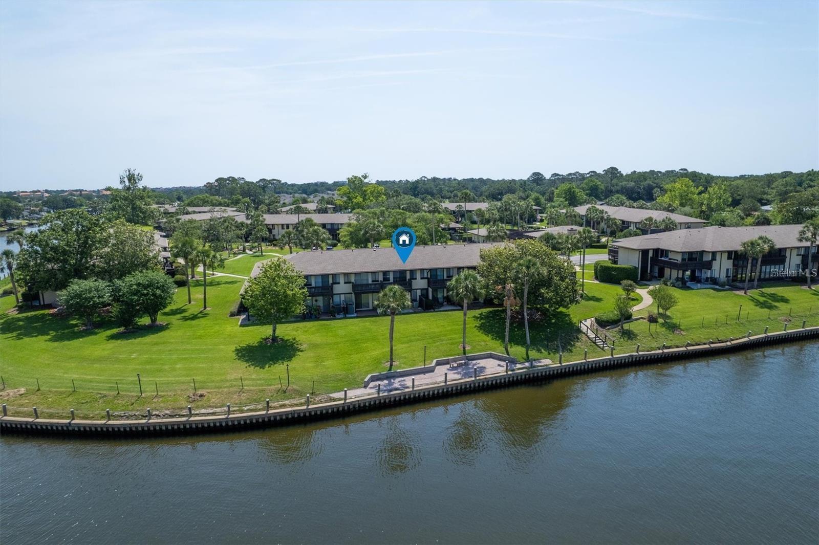 Don’t miss this rare opportunity to own a light-filled WATERFRONT townhome in a peaceful, amenity-rich community! Situated directly on a large saltwater canal, this updated home offers the ultimate Florida lifestyle—whether you're watching boats drift by or enjoying a quiet moment on your private balcony watching the sunset over the water. Inside, you’ll find brand-new flooring upstairs, easy-to-maintain tile downstairs, upgraded vanity and light fixtures, ceiling fans throughout, and an abundance of natural light that fills the space with warmth. The spacious layout is ideal for both everyday living and entertaining. Your HOA takes the stress out of everyday living—covering water, trash, cable/internet, and even pest control. The community features resort-style amenities like a sparkling pool, a welcoming clubhouse, and a scenic walking path—perfect for morning jogs or sunset strolls. Plus, you’re just minutes from golf courses, restaurants, shopping, and more! Whether you're seeking a full-time residence, vacation escape, or investment property, this waterfront gem checks all the boxes. Live where others vacation—schedule your private showing today!
