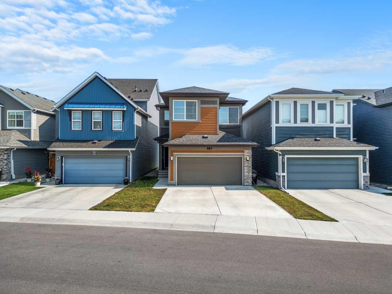 Welcome to 887 Seton Circle, a stunning Jayman Built home, ideally located on a rare traditional homesite in the sought after community of Seton. This highly upgraded home is nearly brand new and features the energy-saving benefits typically found in brand-new construction.

TWELVE SOLAR PANELS, a TANKLESS HOT WATER HEATER, smart thermostat, and TRIPLE-PANE windows help reduce monthly utility bills and make the home more environmentally friendly. For those considering an electric vehicle, the garage has been pre-wired for a future charger installation.

The gourmet kitchen is a standout feature, designed with KitchenAid appliances including a built-in wall oven and a microwave/convection oven combination. Throughout the home, high ceilings create a sense of spaciousness, with 9-FOOT CEILINGS and 8-foot doors on both levels. Luxury vinyl plank flooring has been installed throughout for easy maintenance, while matte black plumbing fixtures contribute to the home's sleek, modern style. The main floor also includes a two-piece bathroom with a vanity and a functional mudroom with built-in lockers.

Upstairs, the primary bedroom is designed as a true retreat. It includes a tray ceiling with LED lighting, custom built-in closet organizers, and a spa-inspired five-piece ensuite bathroom. A large soaker tub provides the perfect space to unwind. Two additional bedrooms share a second five-piece bathroom, and a central bonus room separates them from the primary suite for added privacy.

The unfinished basement offers great potential for future development, with bathroom rough-ins and 9-foot ceilings already in place.

Additional features include Ring cameras at the front and rear doors, smart light switches and thermostat, a smart garage door opener, a high-efficiency two-stage furnace, and a water softener. Seton’s Urban District is home to a variety of restaurants and shops, the world’s largest YMCA, and Calgary’s South Health Campus hospital. Residents also have access to a 13,000-square-foot Homeowners Association facility, located beside a private park exclusive to Seton homeowners. Community amenities include a splash park, hockey rink, tennis courts, gardens, entertainment space, and more.

Come and experience everything this vibrant and growing community has to offer.