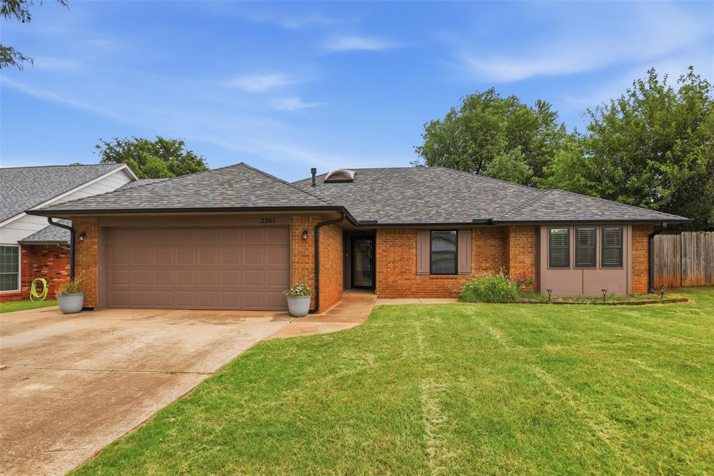 Welcome home to this charming and well-maintained home in the highly sought-after Edmond School District! No HOA. Just minutes to Santa Fe High School. Conveniently located near Broadway Extension and the Turnpike, you'll enjoy easy access to shopping, dining, entertainment, and commuting.A bright foyer welcomes you into the heart of the home, where vaulted ceilings, skylight, and a stunning floor-to-ceiling fireplace create a bright and inviting living space. Built-in bookcase and a wet bar add character and functionality, making this home ideal for entertaining.The kitchen is designed with both style and functionality in mind, featuring granite countertops, white cabinets, a breakfast island, pantry, abundant storage, and generous counter space—perfect for everyday living and entertaining. Primary suite is spacious with a separate bathtub and shower, 2 walk-in closets and 2 vanities. Recent improvements include a newer roof, decking and skylight, new carpet, newer dishwasher, newer windows, and newer hot water heater. Class 4 impact resistant roof shingles.Step outside to enjoy the fully fenced backyard with mature landscaping and a wood deck, providing the perfect space to relax or entertain. Washer, dryer, and dining table with chairs are included, making this home truly move-in ready. Don't miss this fantastic opportunity to own a home that offers comfort, character, and convenience in one of Edmond's most desirable locations.