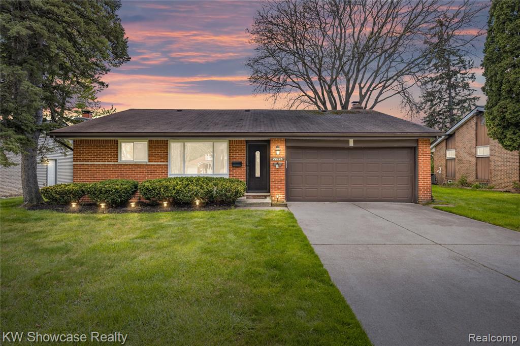 Clean, updated, and ready to go—this solid brick ranch is exactly what today’s buyers are looking for. Set on a quiet, well-kept street, the home offers great curb appeal with a wide driveway, attached 2-car garage, and a spacious yard perfect for relaxing or entertaining.Inside, you’ll find hardwood flooring throughout the main level and a striking floor-to-ceiling stone fireplace that creates a warm, modern focal point in the living space. The layout is both functional and flexible, featuring generously sized bedrooms along with a bonus room that works perfectly as a home office or could easily serve as a third bedroom.The bathrooms have been tastefully updated with clean, contemporary finishes, and the neutral palette throughout makes the home truly move-in ready. Downstairs, the partially finished basement adds valuable living space—ideal for a rec room, workout area, or entertaining—along with plenty of storage and a dedicated laundry area.The furnace, A/C, and windows have all been updated, helping reduce future maintenance costs and giving buyers peace of mind. Combined with the low-maintenance full brick exterior, this is the kind of home that offers both immediate comfort and long-term value.Homes like this—clean, functional, and with the big-ticket items addressed—don’t last. Schedule your showing ASAP before it’s gone. ??